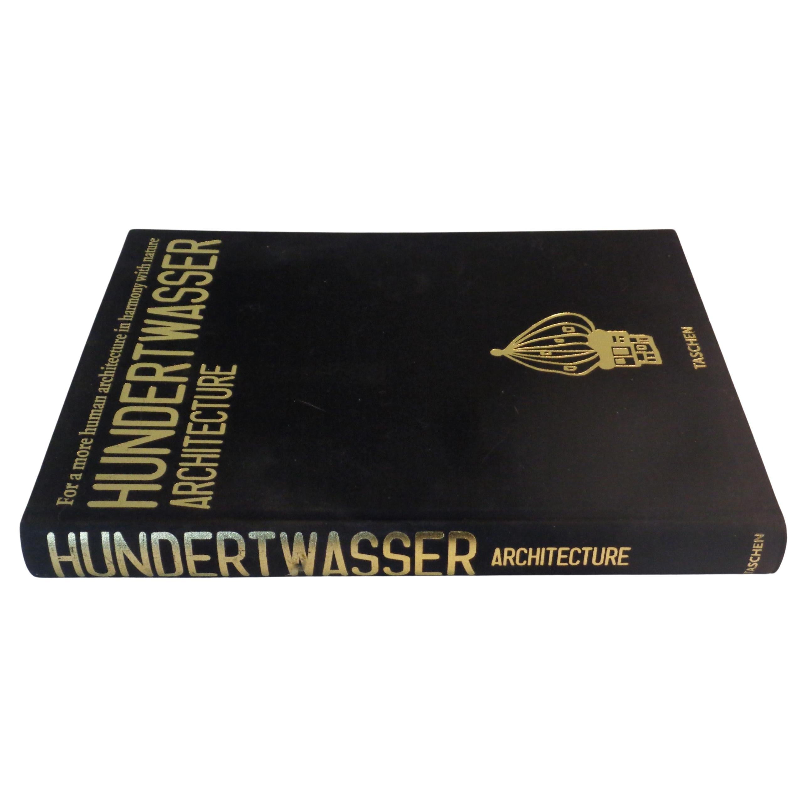 Hundertwasser Architecture 1997 Taschen 1st Edition. Hard cover black cloth with gilt lettering, Includes wrap around die cut band, 317 pages. Catalogue Raisonne of Hundertwasser architecture - illustrations showing period photographs, maps,