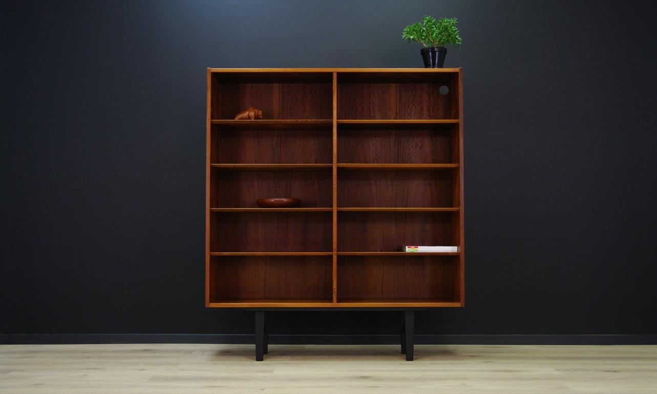 Classic bookcase from 1960s/1970s, Scandinavian design. Veneered with rosewood. Designed by Poul Hundevada, made in the Hundevad & Co. manufacture. Furniture covered with rosewood veneer. Adjustable shelves. Preserved in good condition (minor