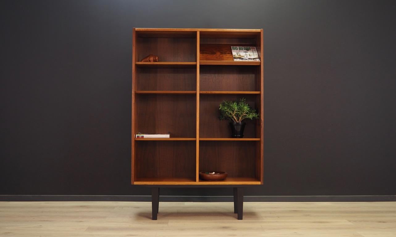 Fantastic bookcase from the 1960s-1970s, Minimalistic form, Danish design. Manufactured by Hundevad & Co. The surface is covered with rosewood veneer. The furniture has six adjustable shelves. Maintained in good condition (minor bruises and