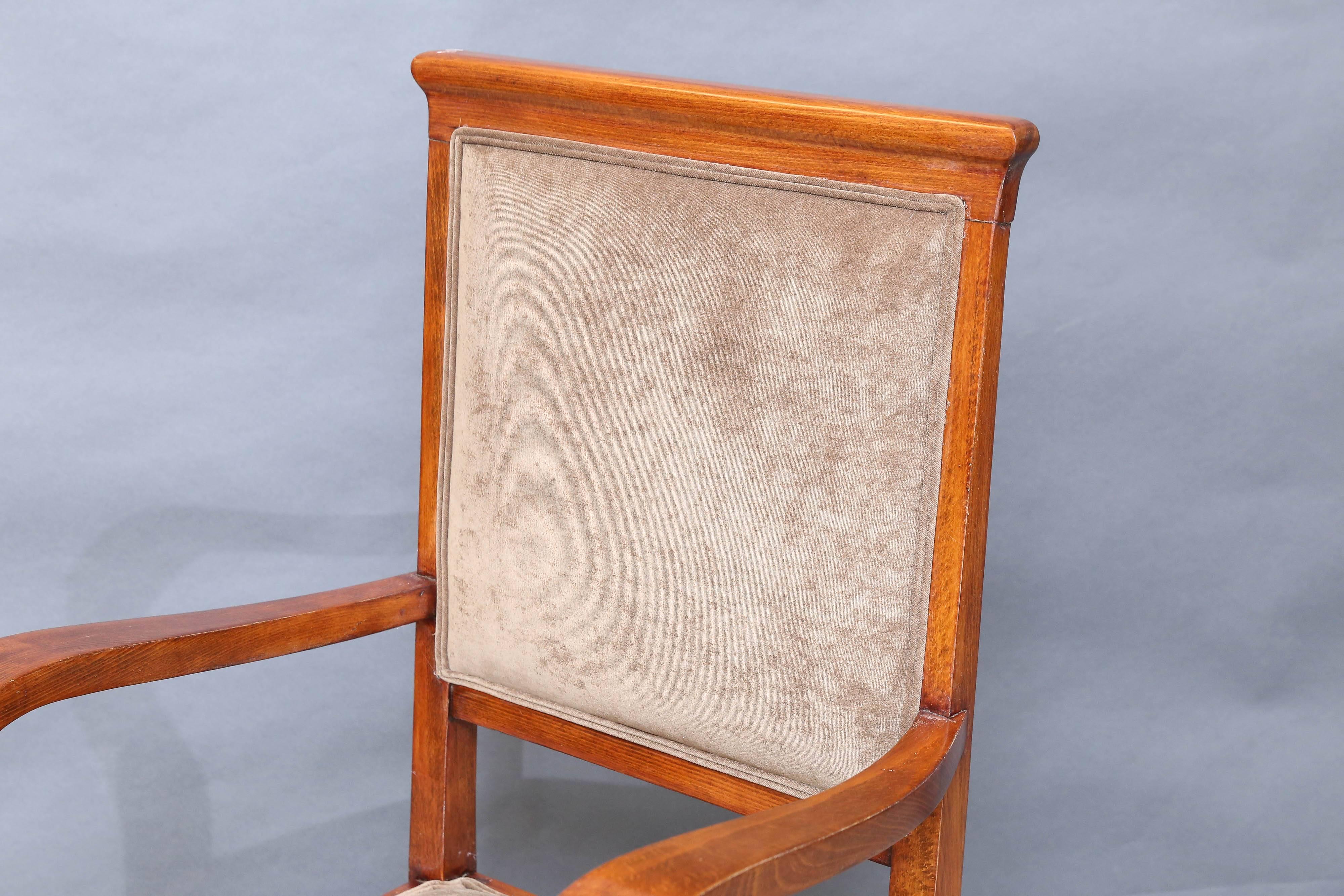 Chair is made out of high quality walnut wood. Back of the chair and seat are newly re-upholstered in a light brown fabric. Back and seat are connected with curved armrests. 
Condition is perfect. Restored. 

Hungary, circa 1930s
 Measure: 23
