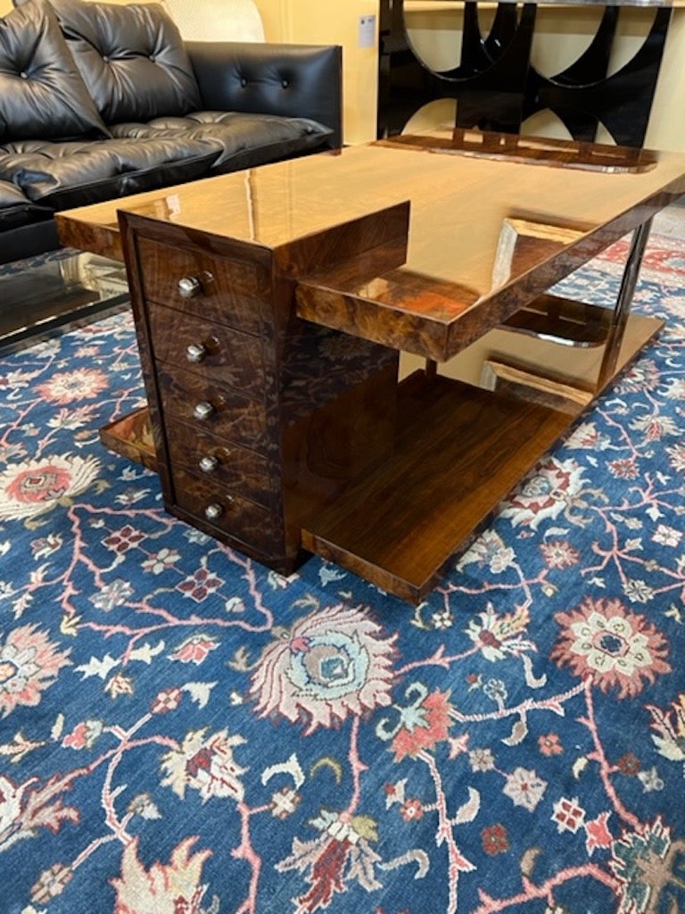 Hungarian coffee table, walnut

A coffee table is build from two wide panels that are connected by a wide wooden pole and two chrome tubes. The table does not have any supporting legs and rests on the whole width of the bottom panel. Has 5 small