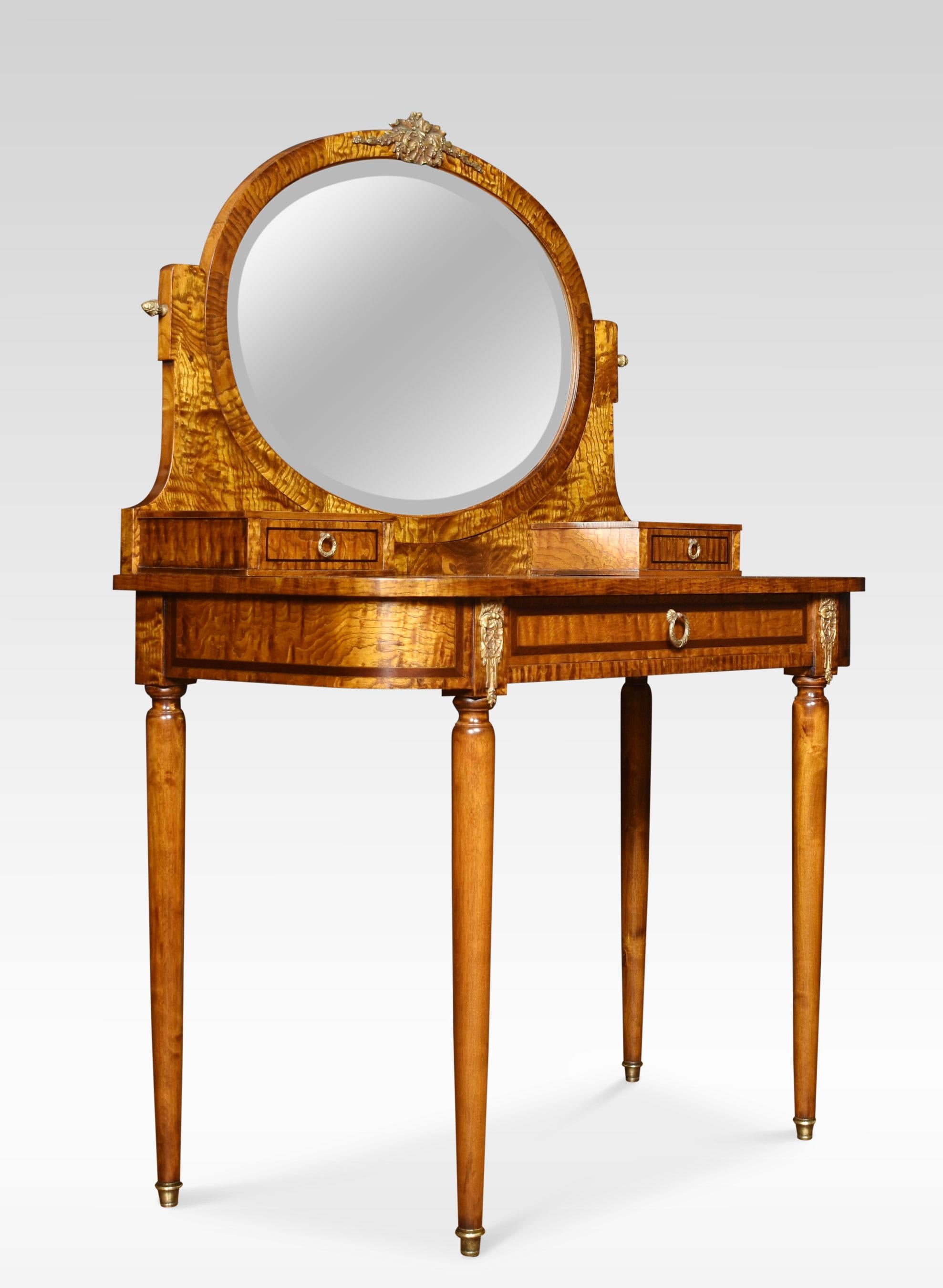 Hungarian ash dressing table, the oval adjustable mirror flanked by superstructure fitted with short drawers. To the large shaped top with inlaid border. The frieze is fitted with a central drawer flanked by gilt metal mounts. All raised up on four