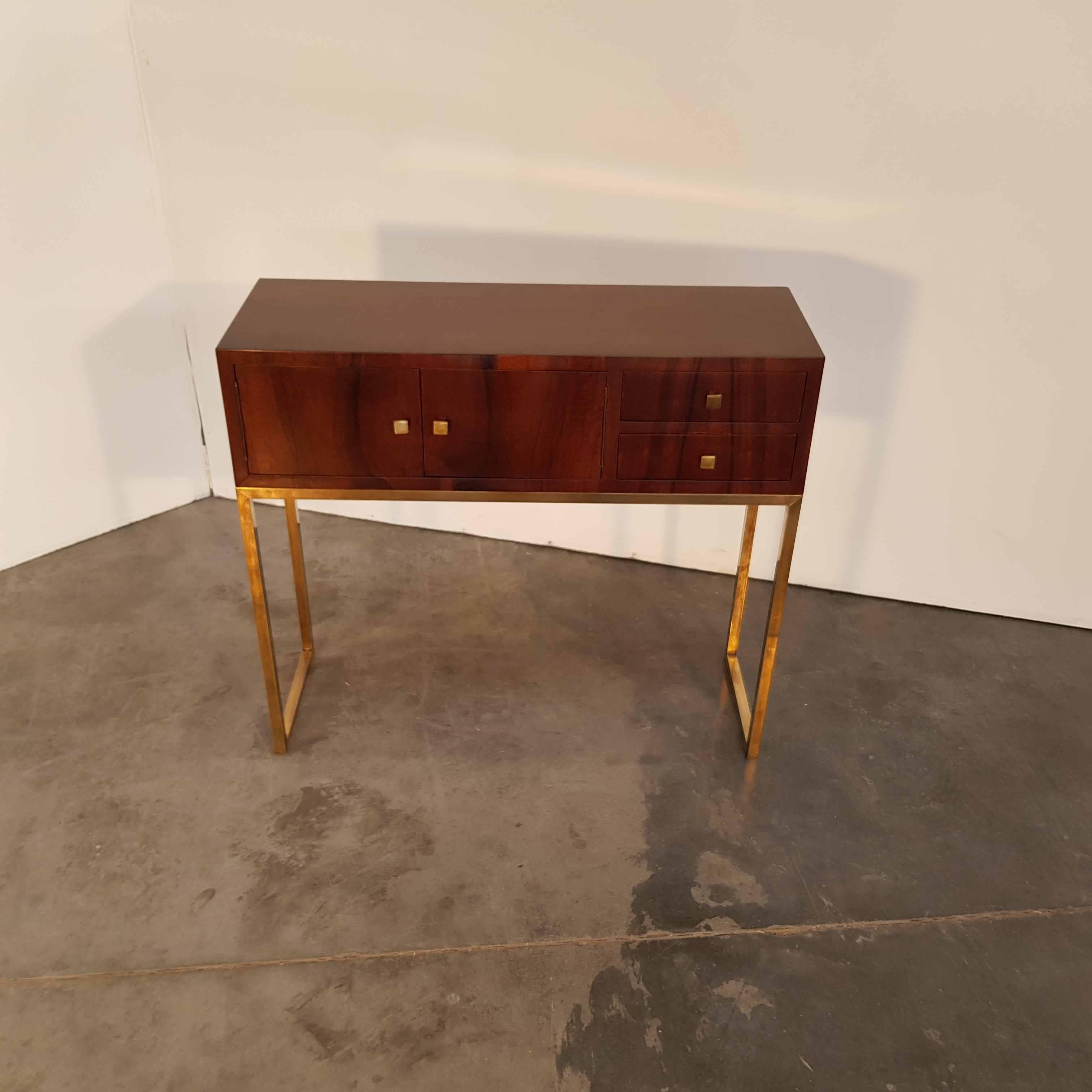 Elegant Bauhaus console on polished brass legs with hand-polished walnut veneer.
From Hungary, 1920s.
Recently restored.