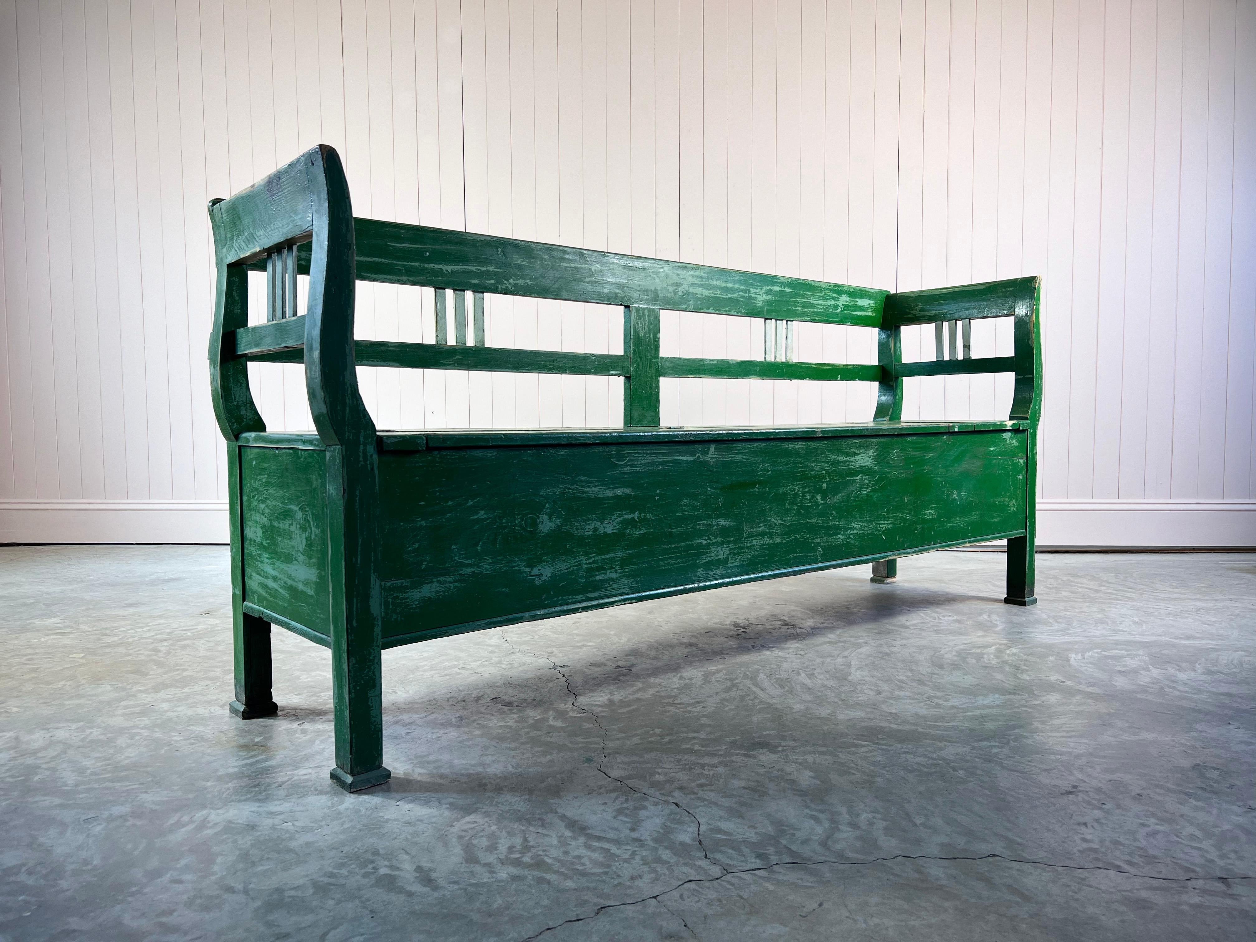 This settle or bench is early 20th Century.  Wonderful natural colours and patina.  

Some restoration, signs of old worm on the back which we have re-treated to be on the safe side.  

A fun and useful piece of furniture. 