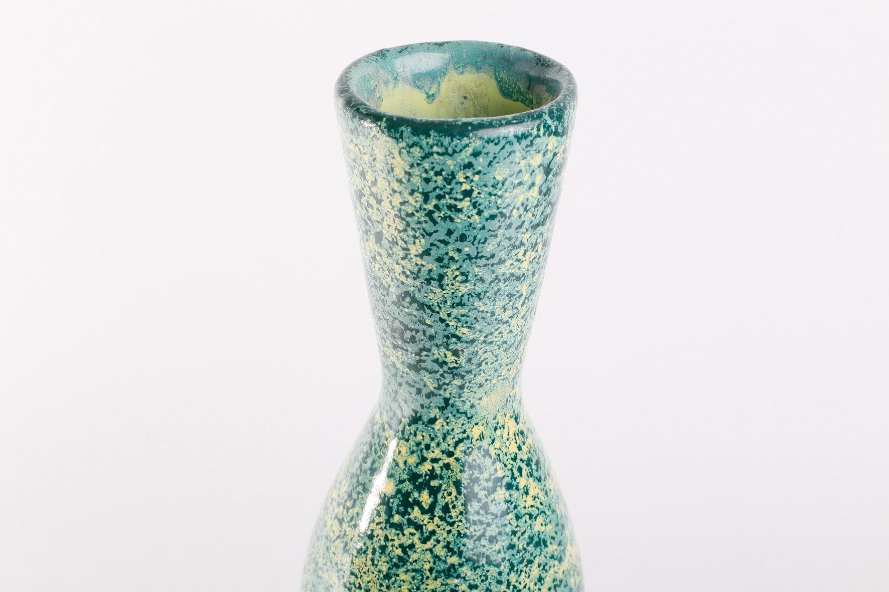 1970s Hungarian ceramic vase, from the 'Tofej' manufactory (Located in Bodrogkeresztur, Hungary)-nice greenish-yellow glaze, paper stamp on the base. Excellent condition.
This piece has an attribution mark such as a manufacturer’s label, a