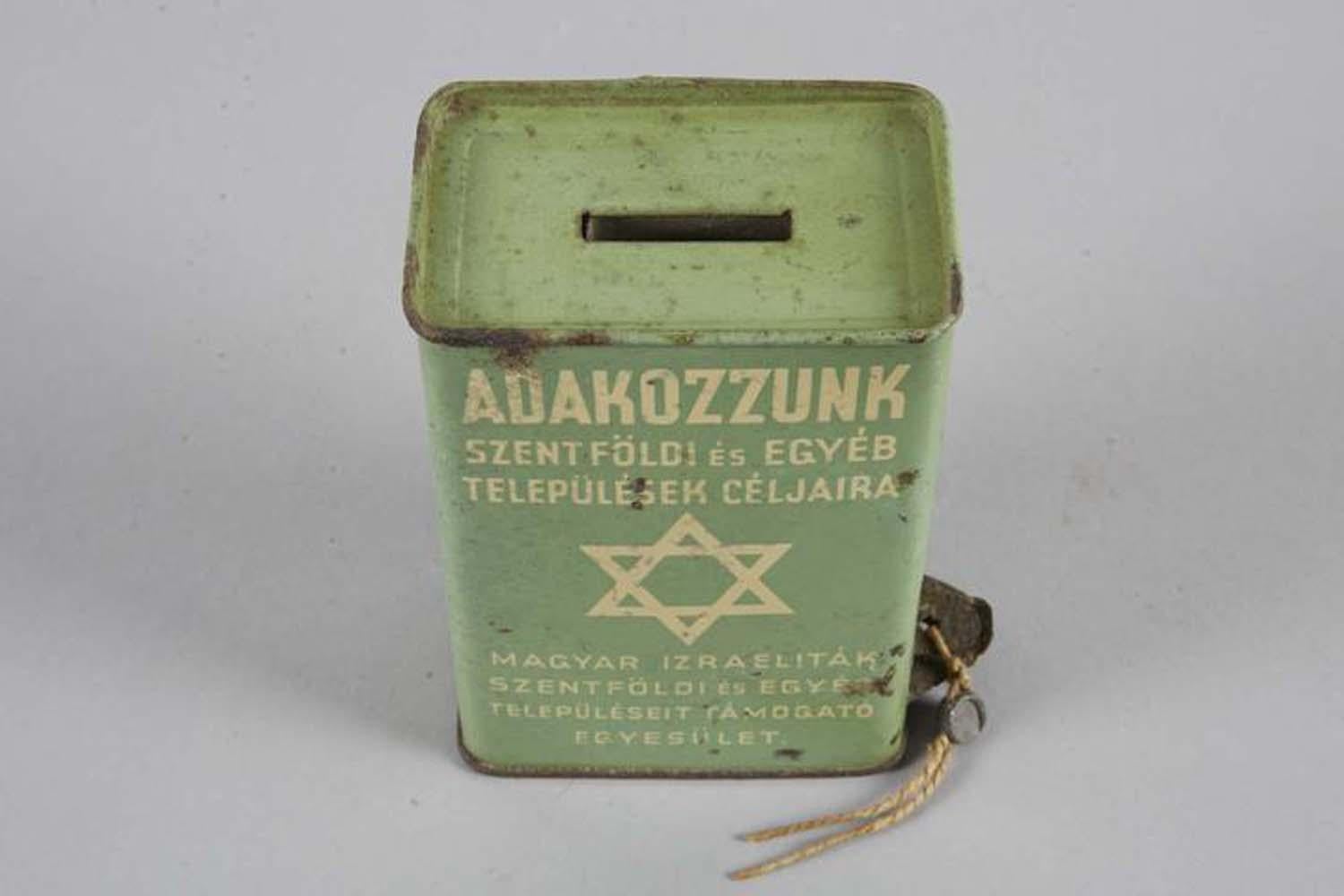 Tin box for collecting donations to Eretz Israel, Hungary, circa 1925.
With Magen David illustrated on both sides, Hungarian: 