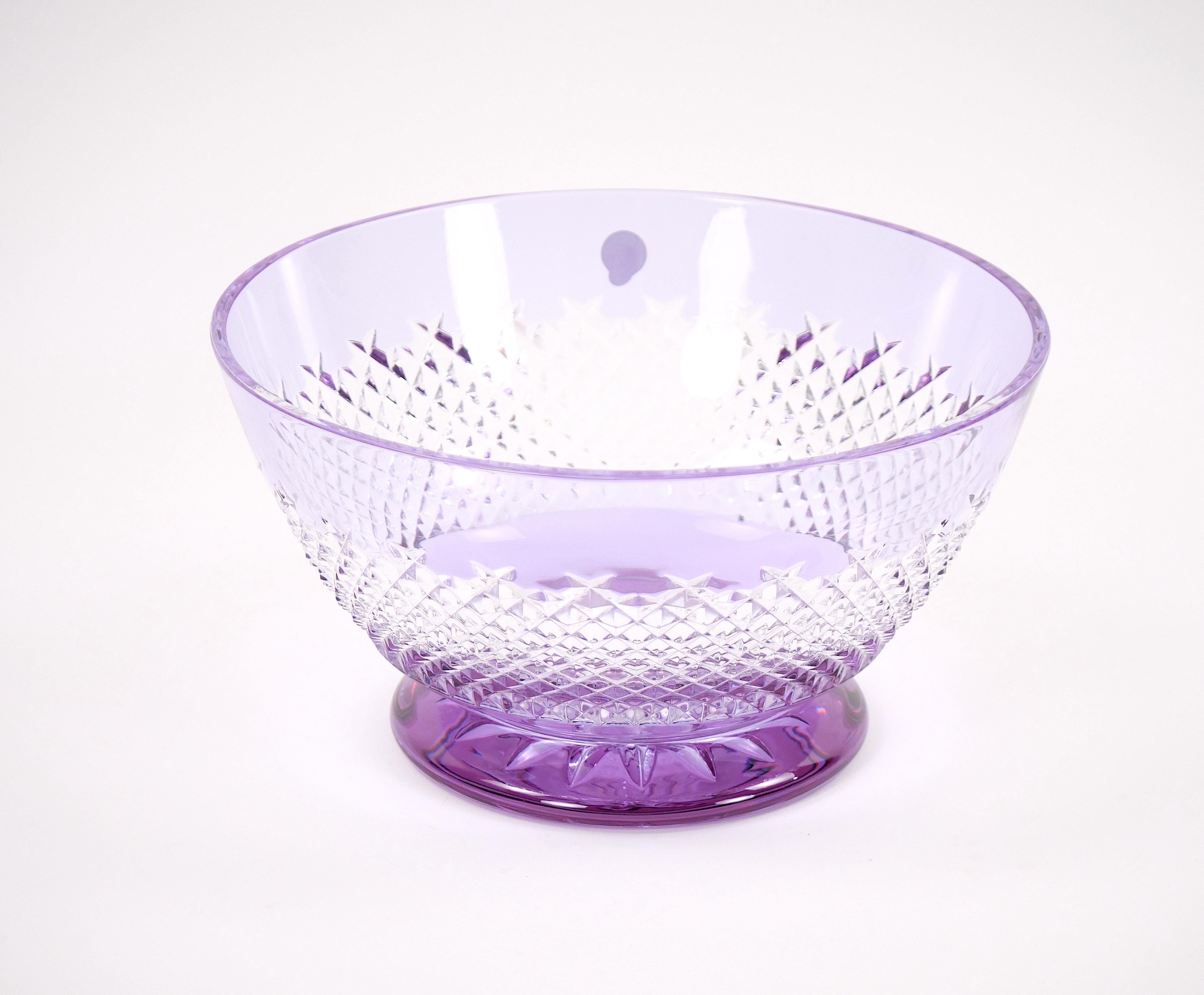 An exceptional and rare 20th century Waterford lead crystal bowl in a stunning ice-purple / amethyst tone, a color highly sought after by collectors. This impressive piece is masterfully cut with a refined diamond pattern that reflects light with
