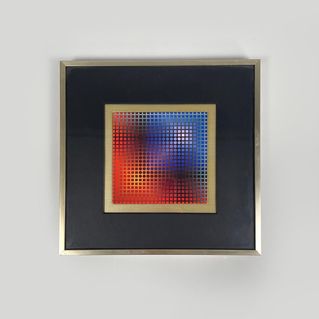 Tableau moderne hongrois d'art optique avec cadre en métal par Victor Vasarely, années 1970
Peinture avec cadre en métal doré. Le tableau représente une composition géométrique colorée dans le plus pur style de l'Optical Art, dans des tons de rouge