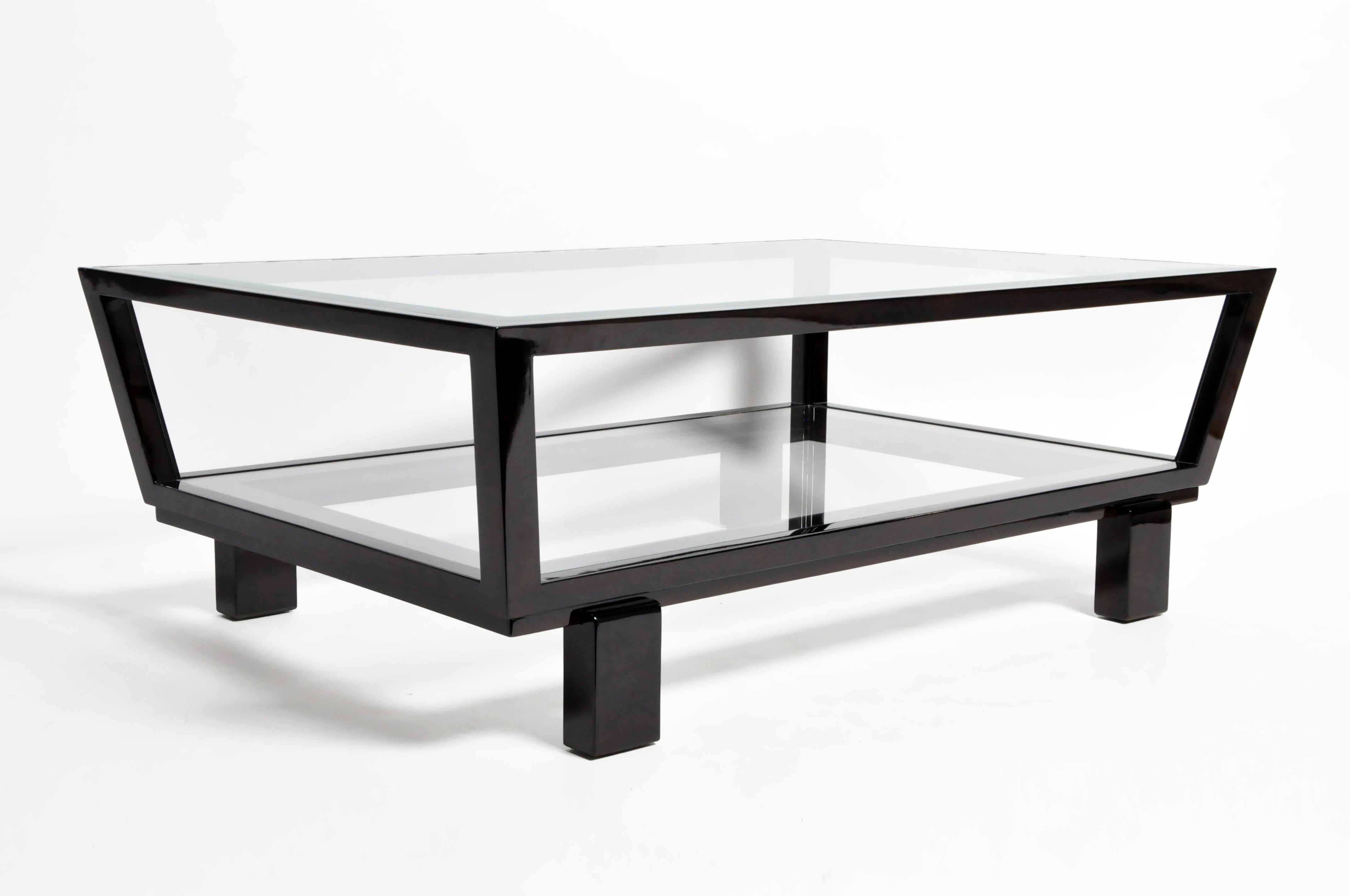 This newly made elegant coffee table is from Hungary and made from solid beech wood and glass. The table features a glass top and a glass shelf underneath for storage, the table has clean beautiful lines for a modern feel.