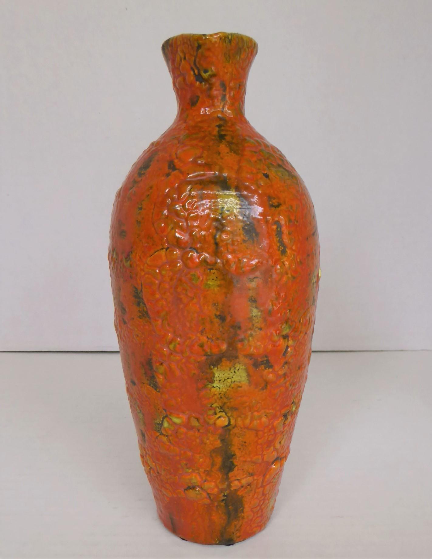 REDDUCED FROM $215....This lovely Hungarian lava glaze handled Ewer in bright orange dates from the late 60s to early 1970s. The heavy tomato orange glazed has been fired on a yellow background which peeks in parts under the lava glaze and has been