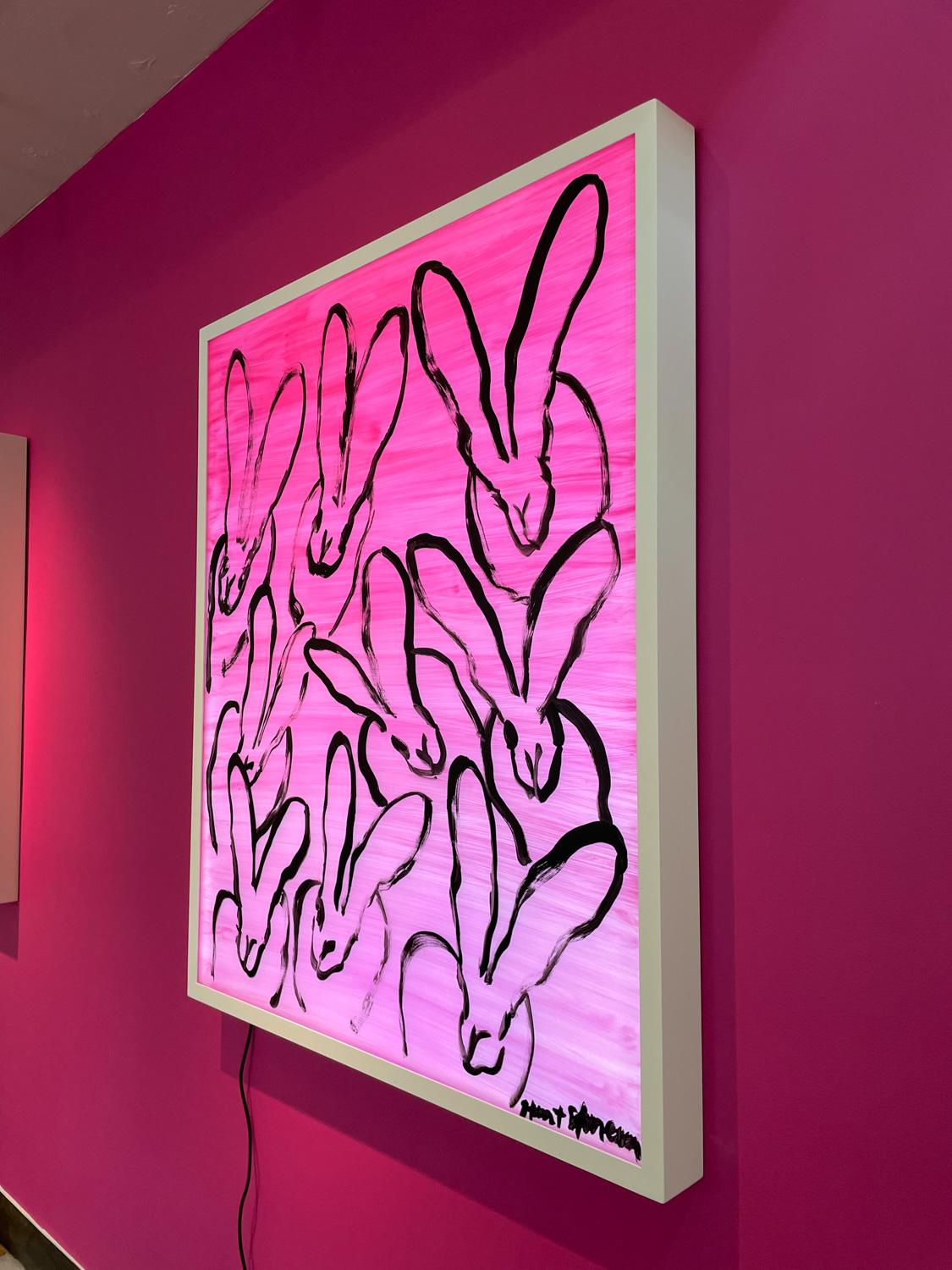 Hunt Slonem LED Lightbox with acrylic painted bunnies and powerful pink background. A nearby electrical outlet is required for installation.

Inspired by nature and his 60 pet birds, Hunt Slonem is renowned for his distinct neo- expressionist style.