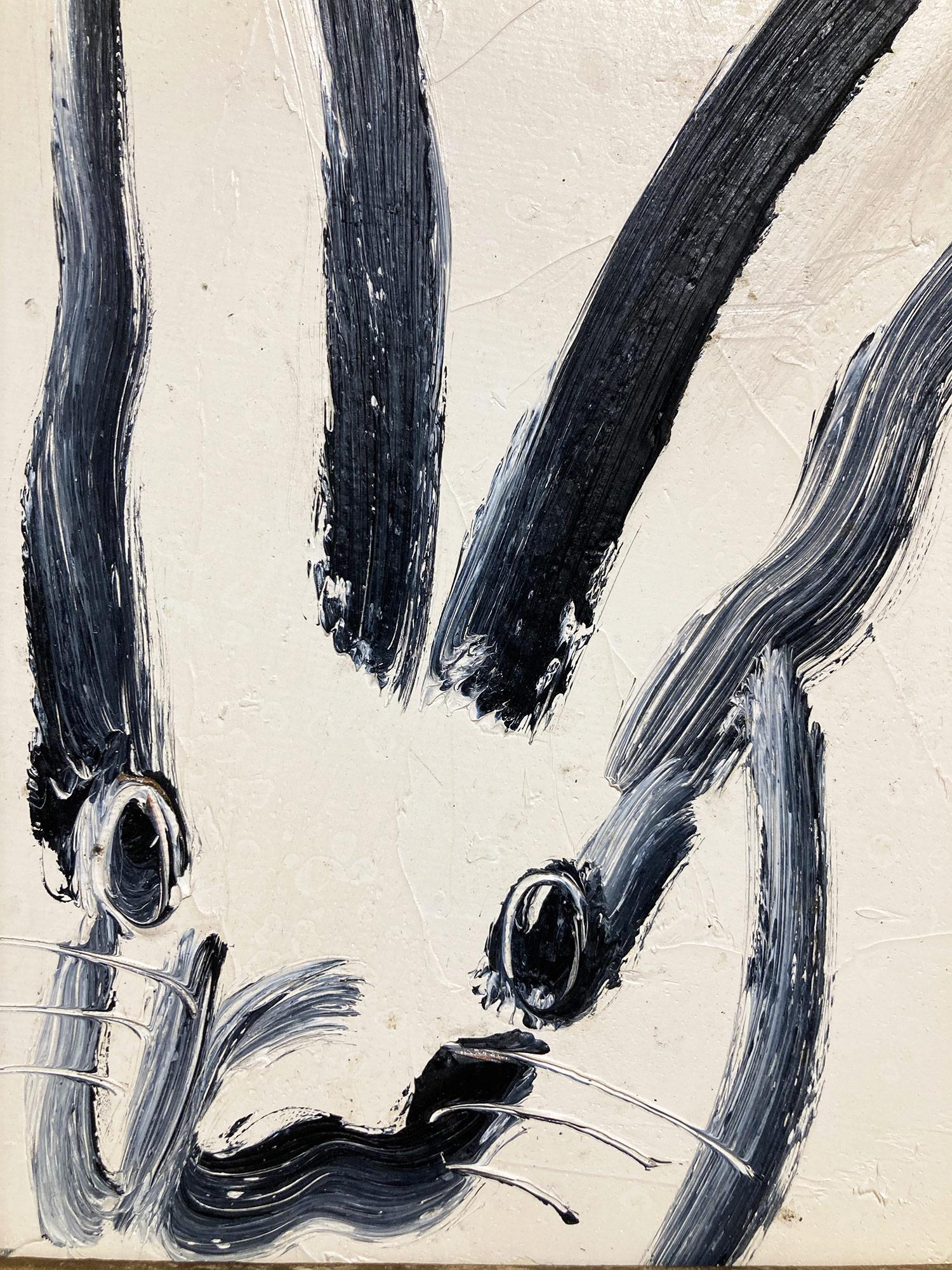 A wonderful composition of one of Slonem's most iconic subjects, Bunnies. This piece depicts a gestural figure of a black bunny on white background with thick use of paint. It is housed in a wonderful frame. Inspired by nature and a genuine love for
