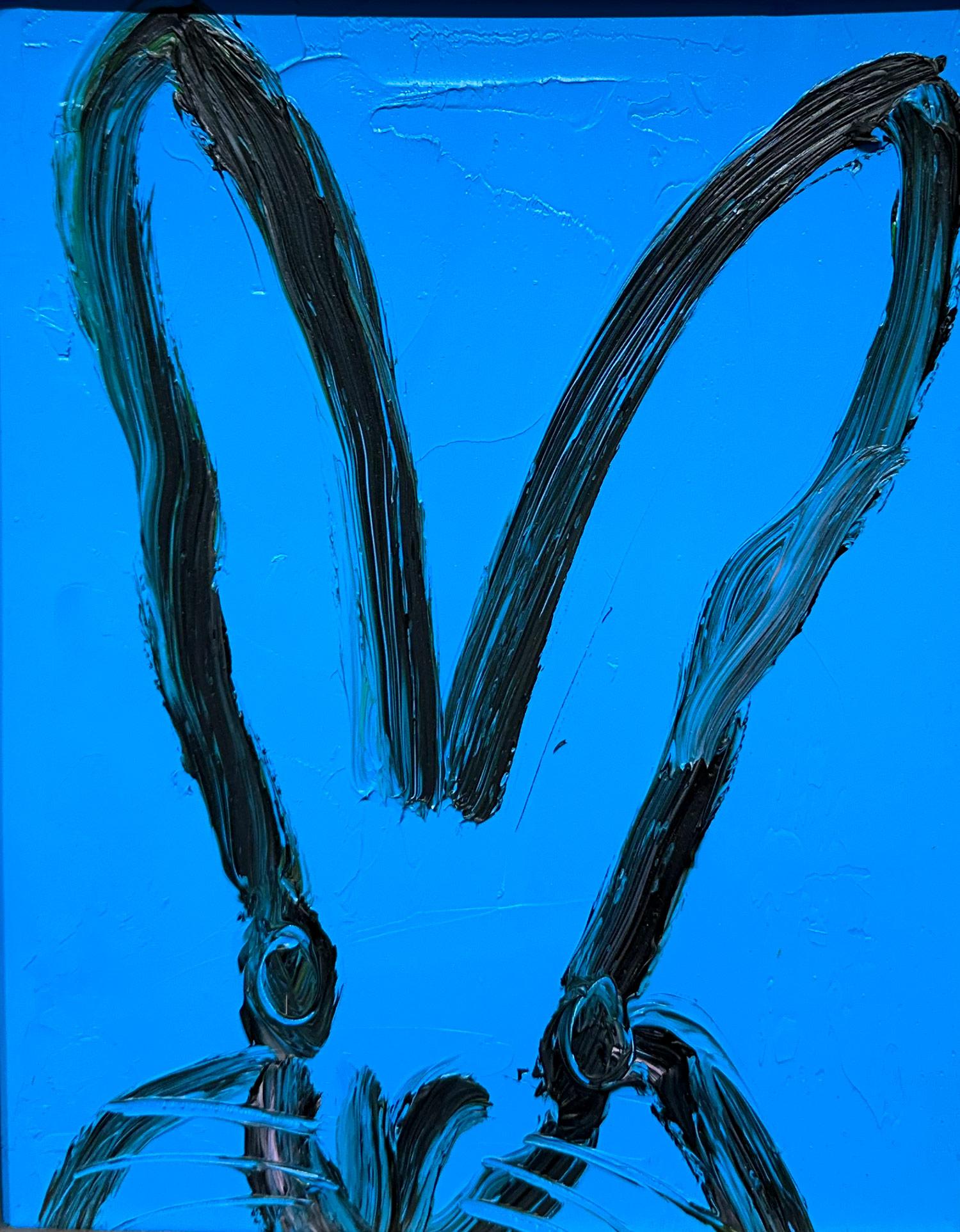 A wonderful composition of one of Slonem's most iconic subjects, Bunnies. This piece depicts a gestural figure of a black bunny on a French Blue background with thick use of paint. It is housed in a wonderful gold tone wood frame. Inspired by nature