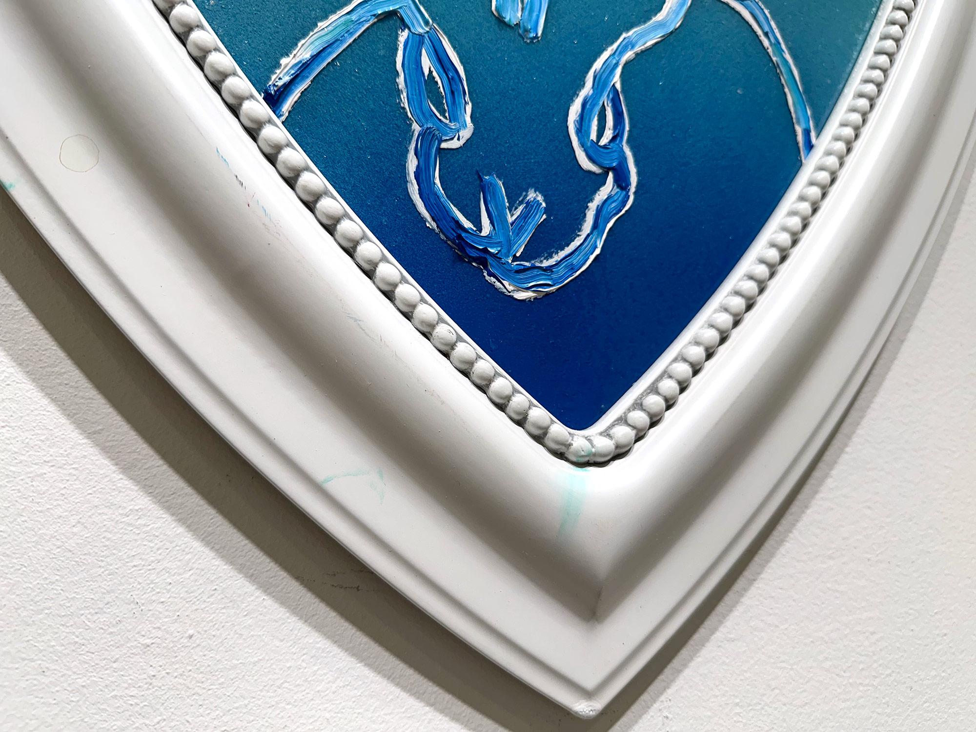 A wonderful composition of one of Slonem's most iconic subjects, Bunnies. This piece depicts a double bunny on a turquoise blue gradient background with thick use of paint and diamond dust. It is housed in a wonderful white heart shaped frame.