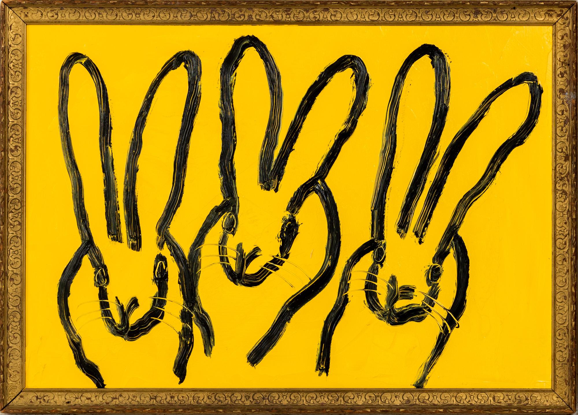 "3 Play Monday" is a framed oil painting on wood by Hunt Slonem, depicting a hutch of rabbits set against a vibrant yellow background. 

This piece is finished in an antique frame, which has been hand-selected by the artist for this painting. The