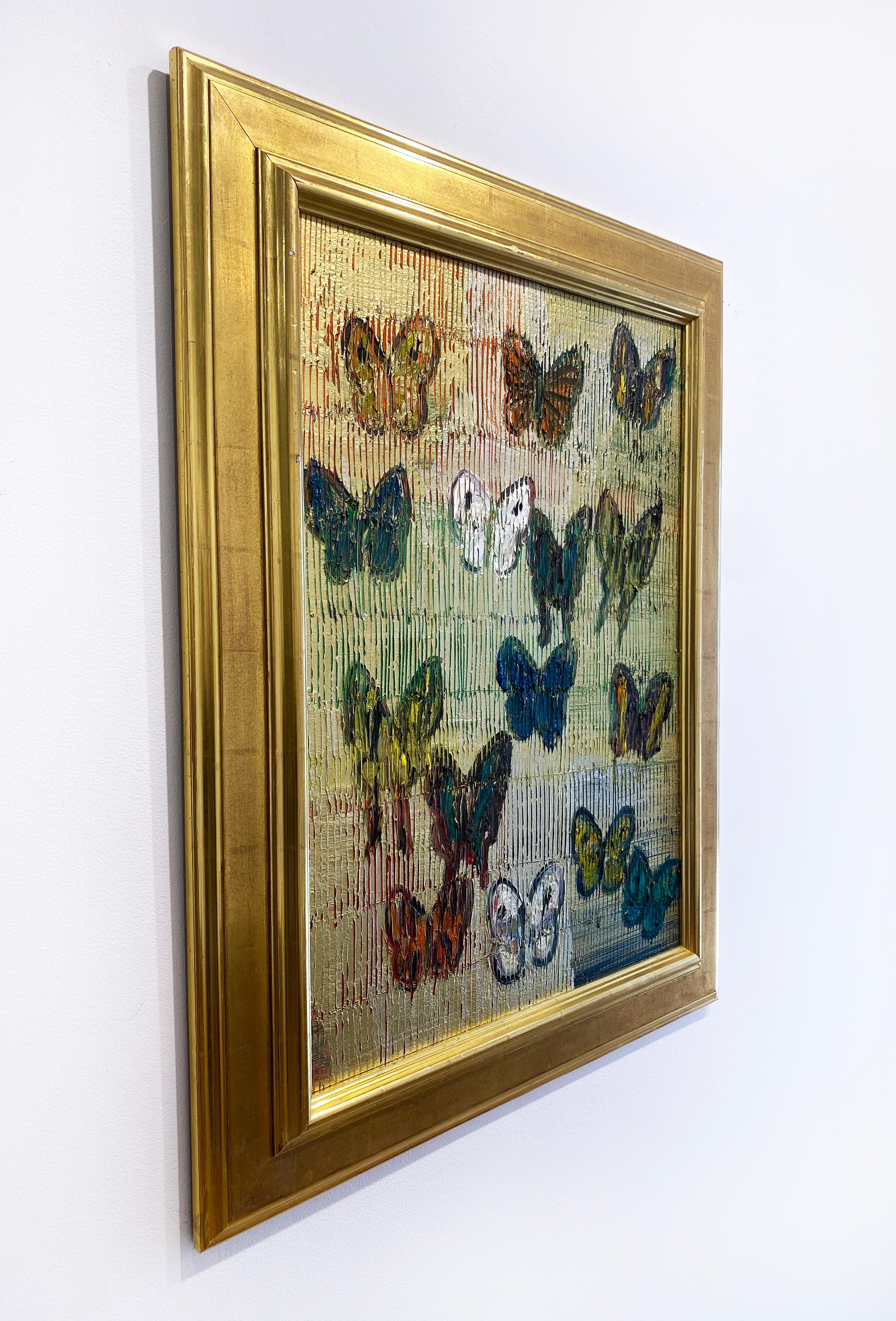 'Soar I' 2021 by renowned New York City artist, Hunt Slonem. Oil on wood, 30 x 22 in. Framed dimmension is 37.5 x 29 in. This painting features a charming portrait of colorful butterflies. The butterflies are painted in a palette of colors of