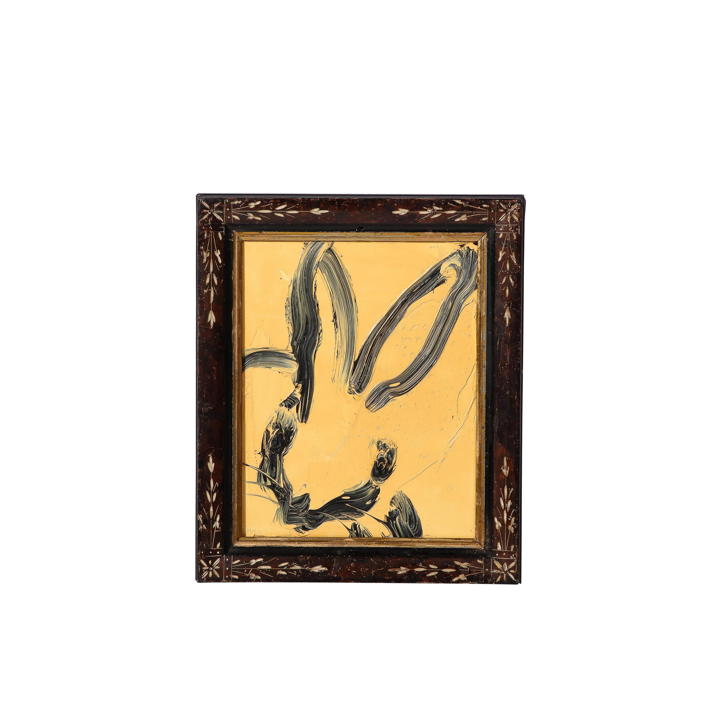 This whimsical and sophisticated painting was realized by the esteemed contemporary painter, Hunt Slonem in 2013. This piece features a lovely background in a muted sunflower yellow with bold and deftly rendered brush strokes depicting a rabbit in