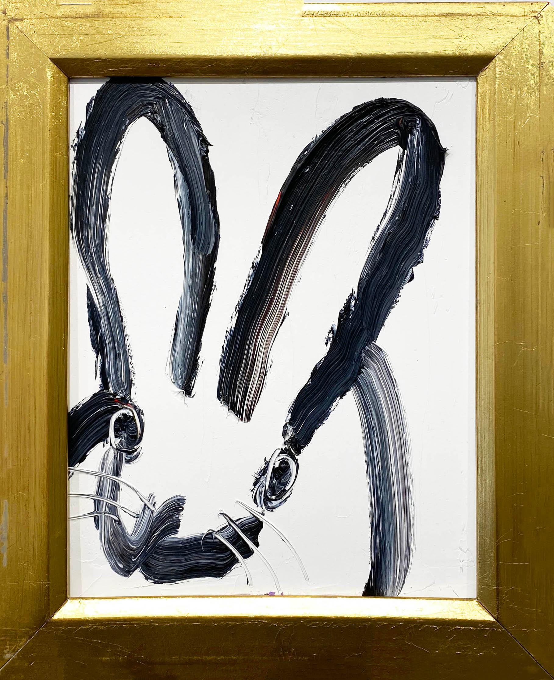 Hunt Slonem bunny oil painting 'Anthony' 2024. Oil on wood, 10 x 8 in. / Frame: 12 x 10 in. This painting features Slonem's signature bunny outlined in black over a white background. Includes a handpicked, antique wood frame.

Considered one of the