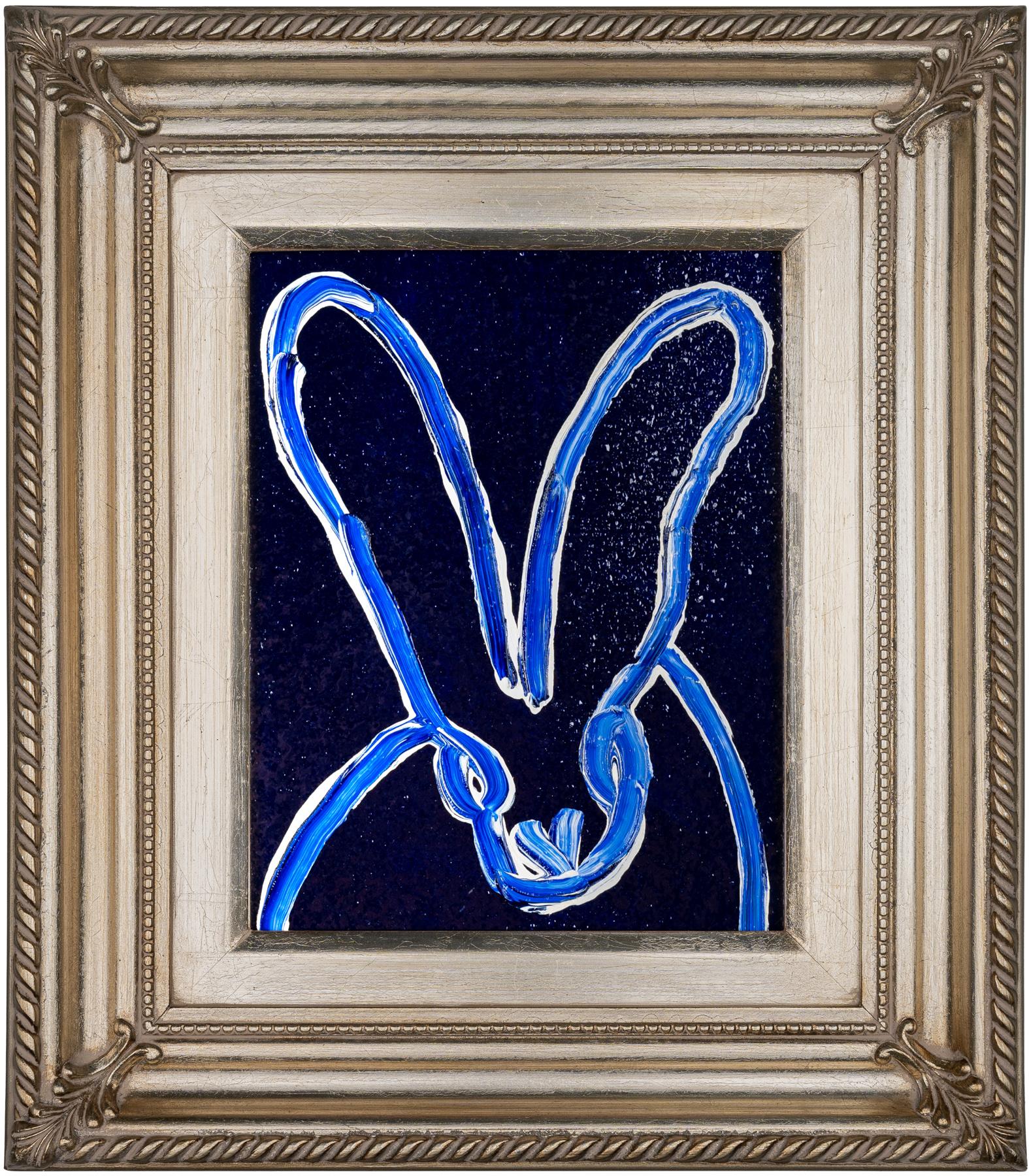 Hunt Slonem bunny oil painting 'Blue Tanzanite Tango' 2023. Oil and acrylic with diamond dust on wood, 10 x 8 in. / Frame: 16 x 14 in. This painting features Slonem's signature bunny outlined in blue and white over a cobalt blue, diamond dust