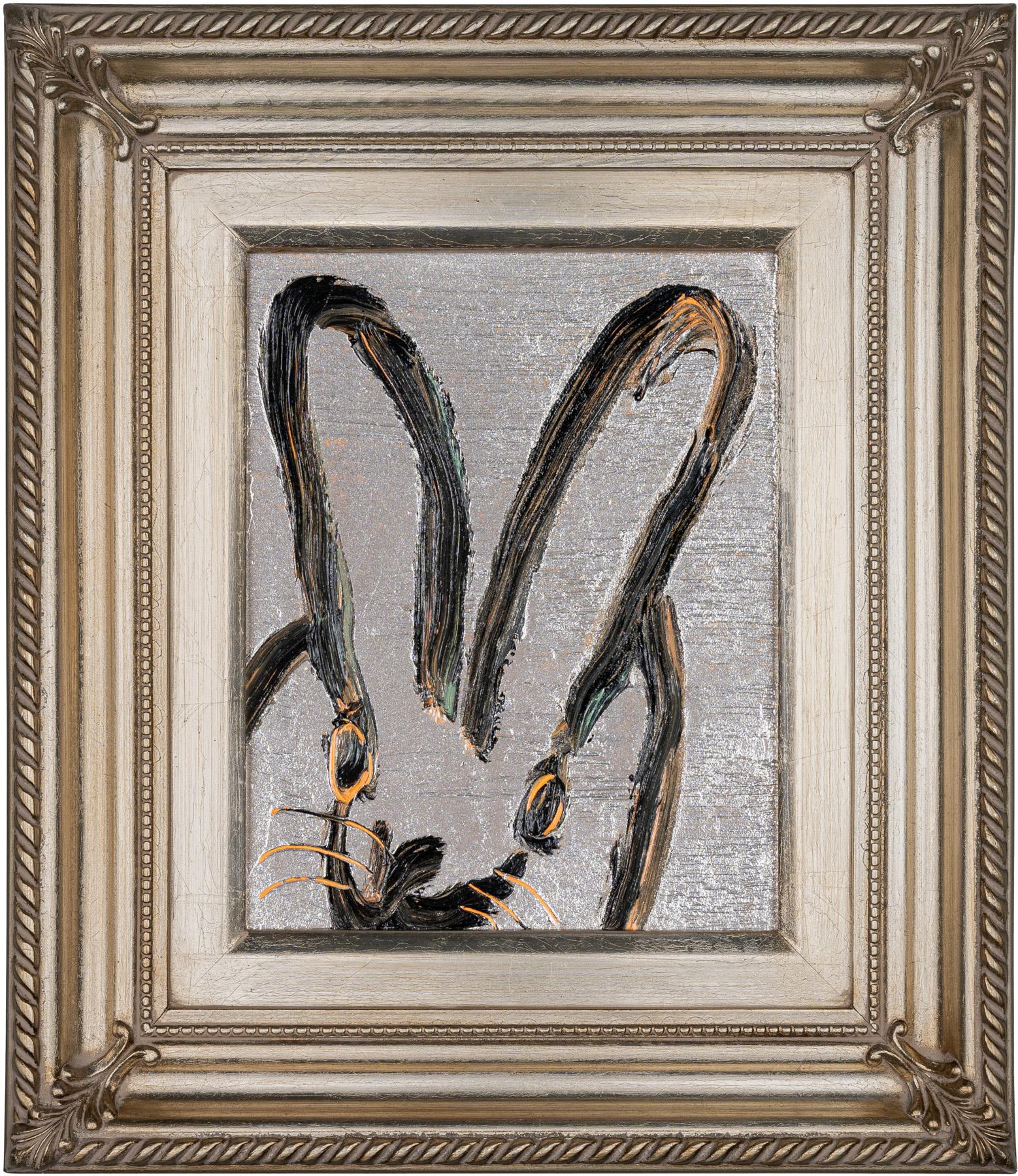 Hunt Slonem bunny oil painting Hunt Slonem bunny oil painting 'Smooch' 2023. Oil on wood, 10 x 8 in. / Frame: 16 x 14 in. This painting features Slonem's signature bunny outlined in black and orange over a silver painted background. Includes a