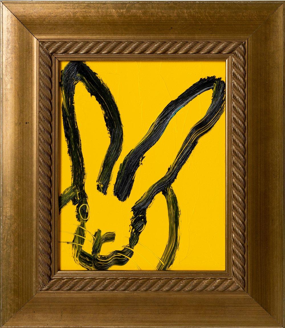 Renowned artist Hunt Slonem's "Hundreds" is a 10x8 oil painting on wood board of a single contemporary abstract rabbit in black against a yellow background.

*Painting is framed - Please note that not all Hunt Slonem frames are in mint condition.