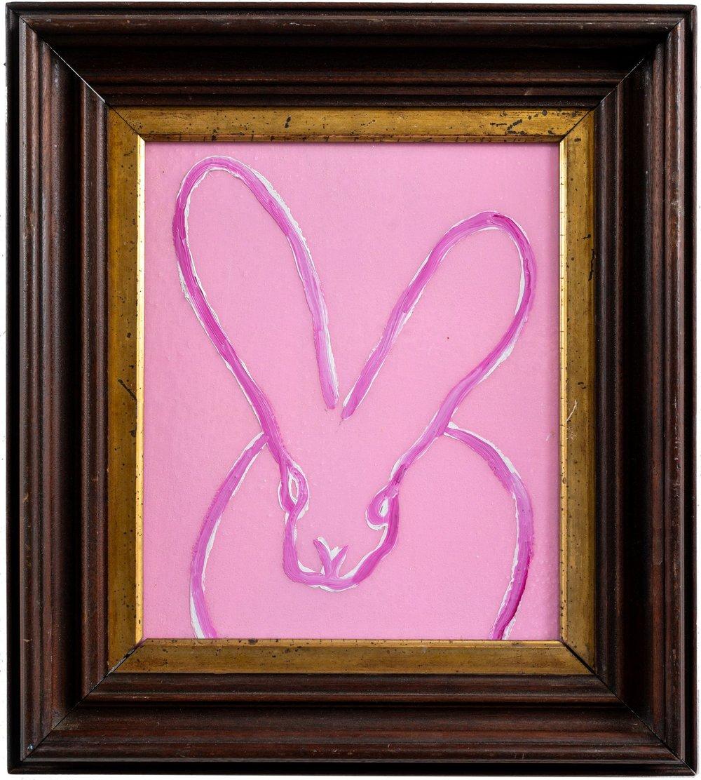 Renowned artist Hunt Slonem's "In the Pink" is a 12.5x11 oil painting on wood featuring a pink and white bunny outline over a lighter pink background with diamond dust, finished with the artist's choice of antique brown and gold framing.

*Painting
