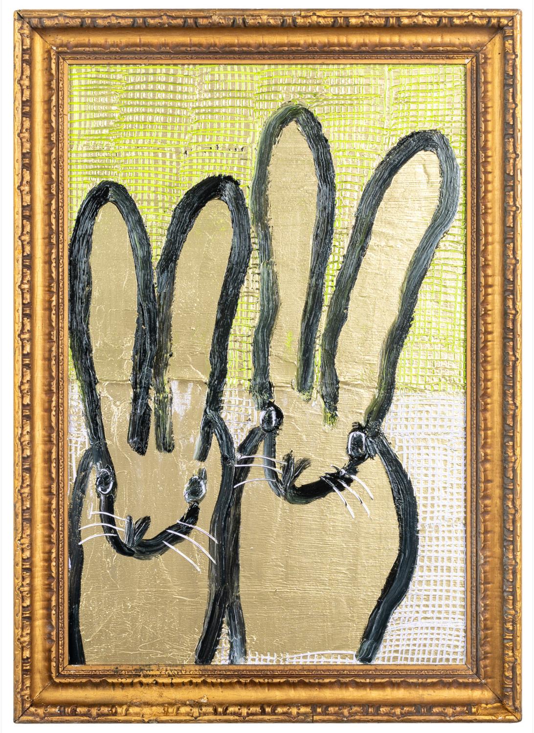 Renowned artist Hunt Slonem's "Major Leap" is a 24x16 oil painting on wood board of contemporary abstract painting of two bunnies colored with metallic gold.  The gold background is scored with green and pink, creating interest and texture.