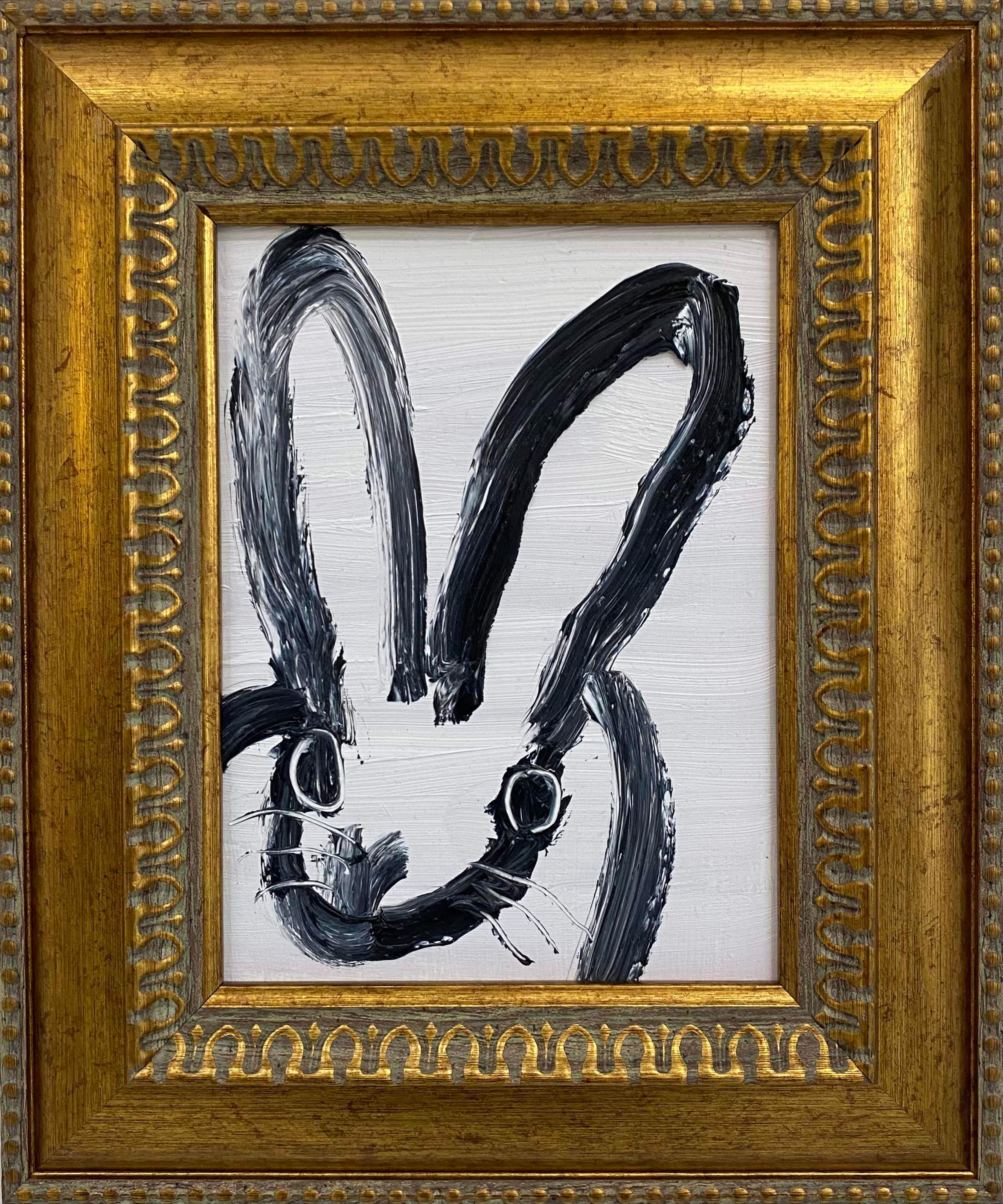 Hunt Slonem "Mandy 2" Black and White Bunny
A single rabbit gestured in black on a white background in a vintage frame

Unframed: 8 x 6 inches
Framed: 12.5 x 10.5 inches
*Painting is framed - Please note Hunt Slonem paintings with frames may show