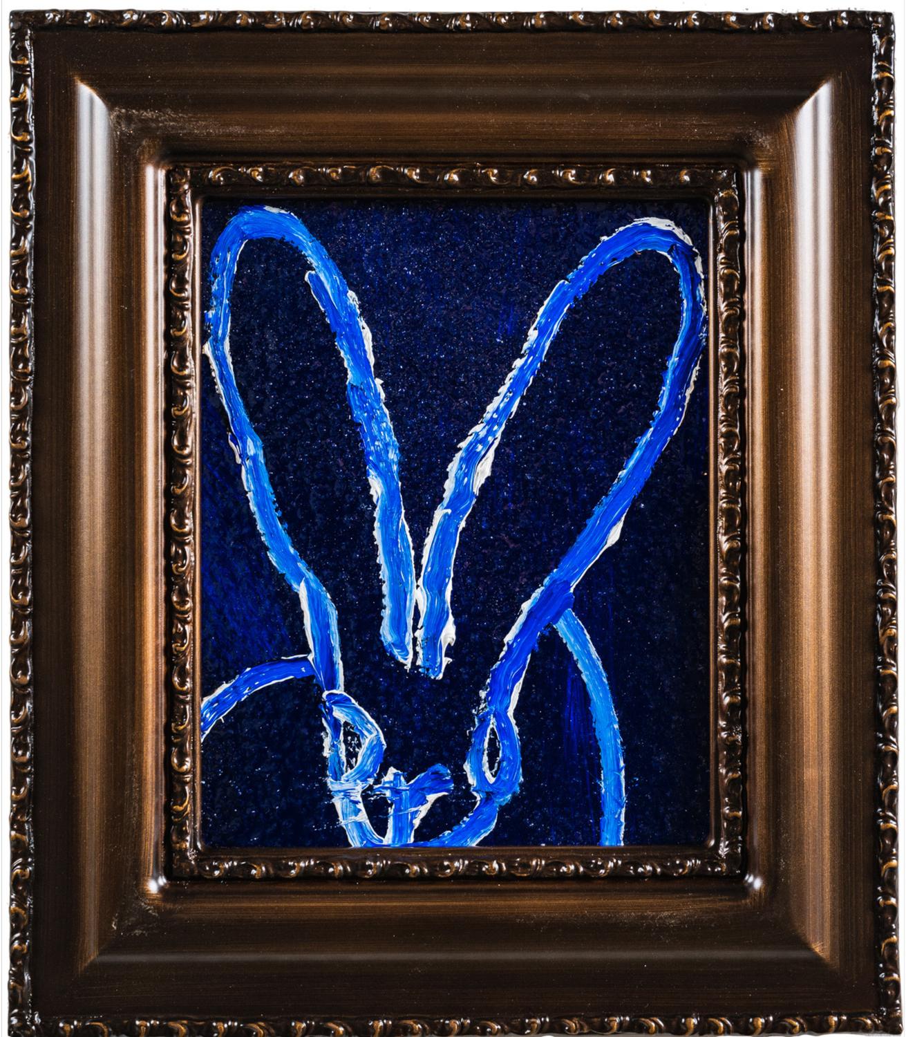 Renowned artist Hunt Slonem's "Moon Walk 3" is a 10x8 deep blue oil painting with diamond dust on wood board of a contemporary abstract rabbit in his choice of antique framing.

*Painting is framed - Please note that not all Hunt Slonem frames are