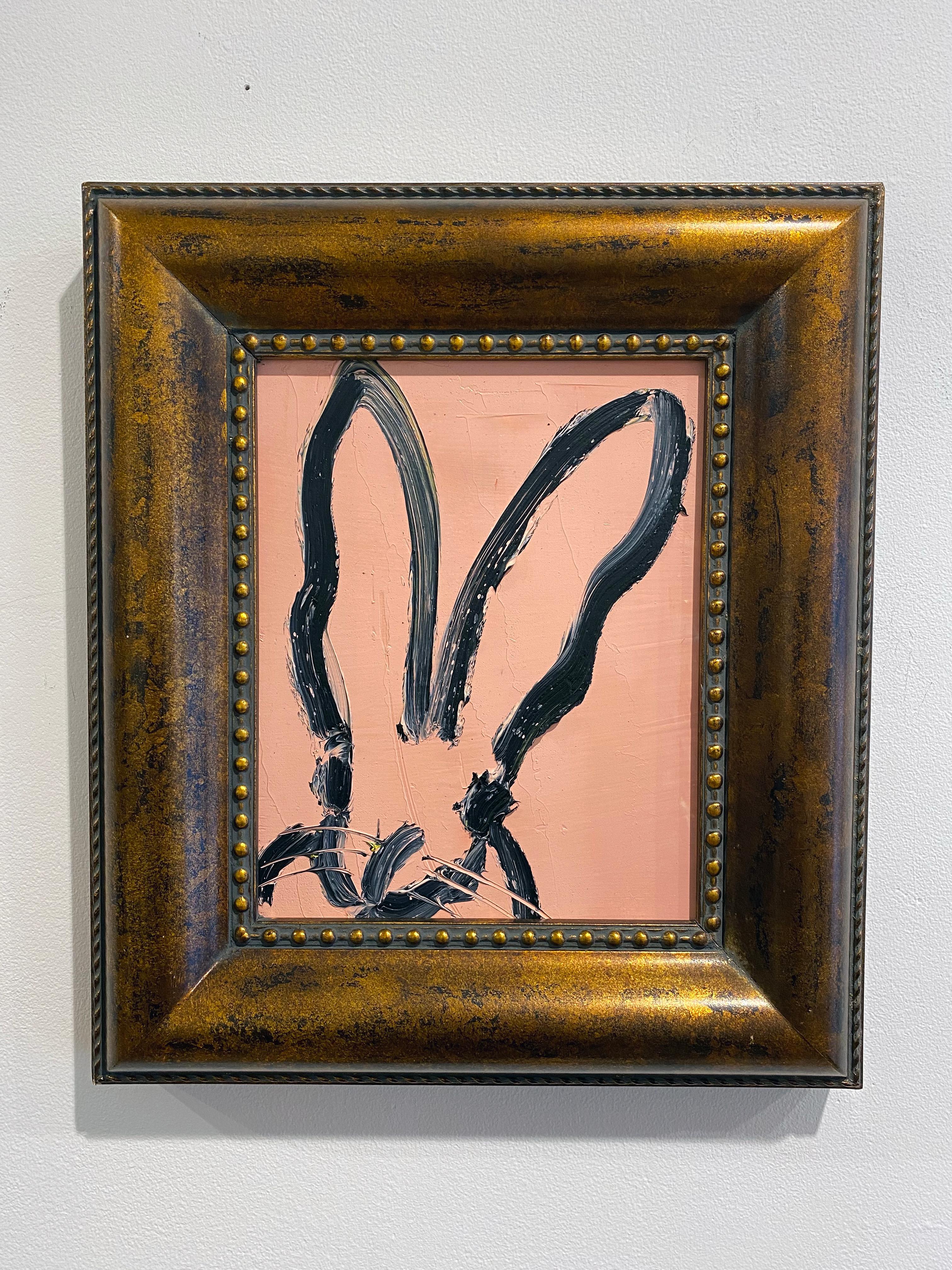 'Audrey Hepburn' by Hunt Slonem, 2020. Oil on wood, 10 x 8 in. Framed size is 15 x 13.5 in. This painting features Slonem's signature bunny outlined in black on a  pastel, classy pink background. Framed in a carved wood frame with antiqued gold