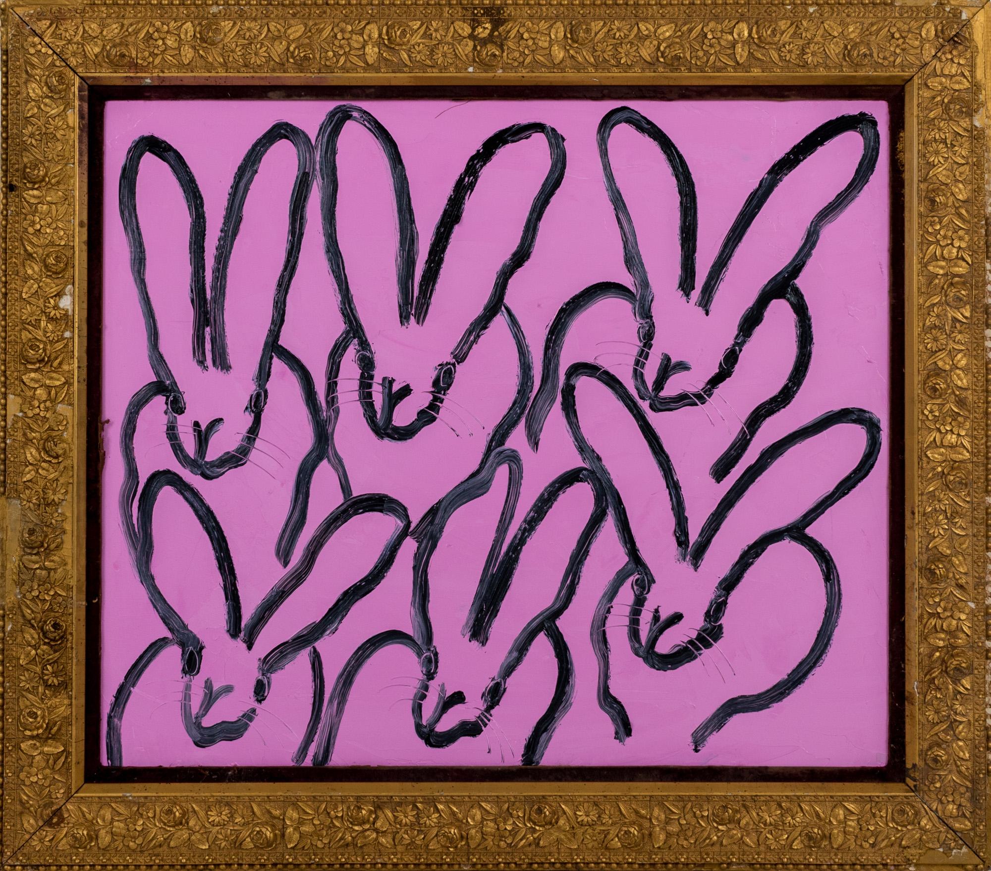 "Pink Run" is a framed oil painting on canvas by Hunt Slonem, depicting a hutch of bunnies set against a stark pink background. 

This piece is finished in an antique frame, which has been hand-selected by the artist for this painting. The frame may