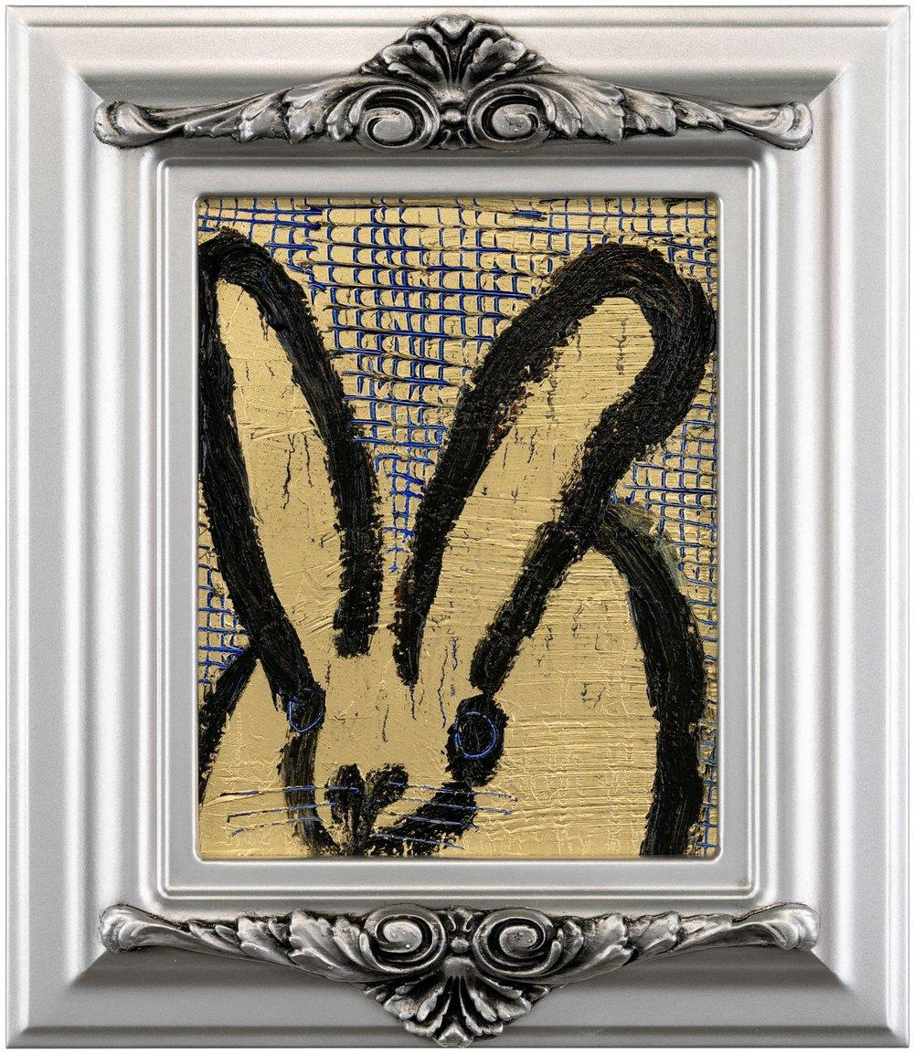 Renowned artist Hunt Slonem's "Score Card" is a 10x8 oil painting on wood board of a contemporary abstract black rabbit in his choice of silver antique framing. Gold leaf with gridded scoring complete the background. 

*Painting is framed - Please