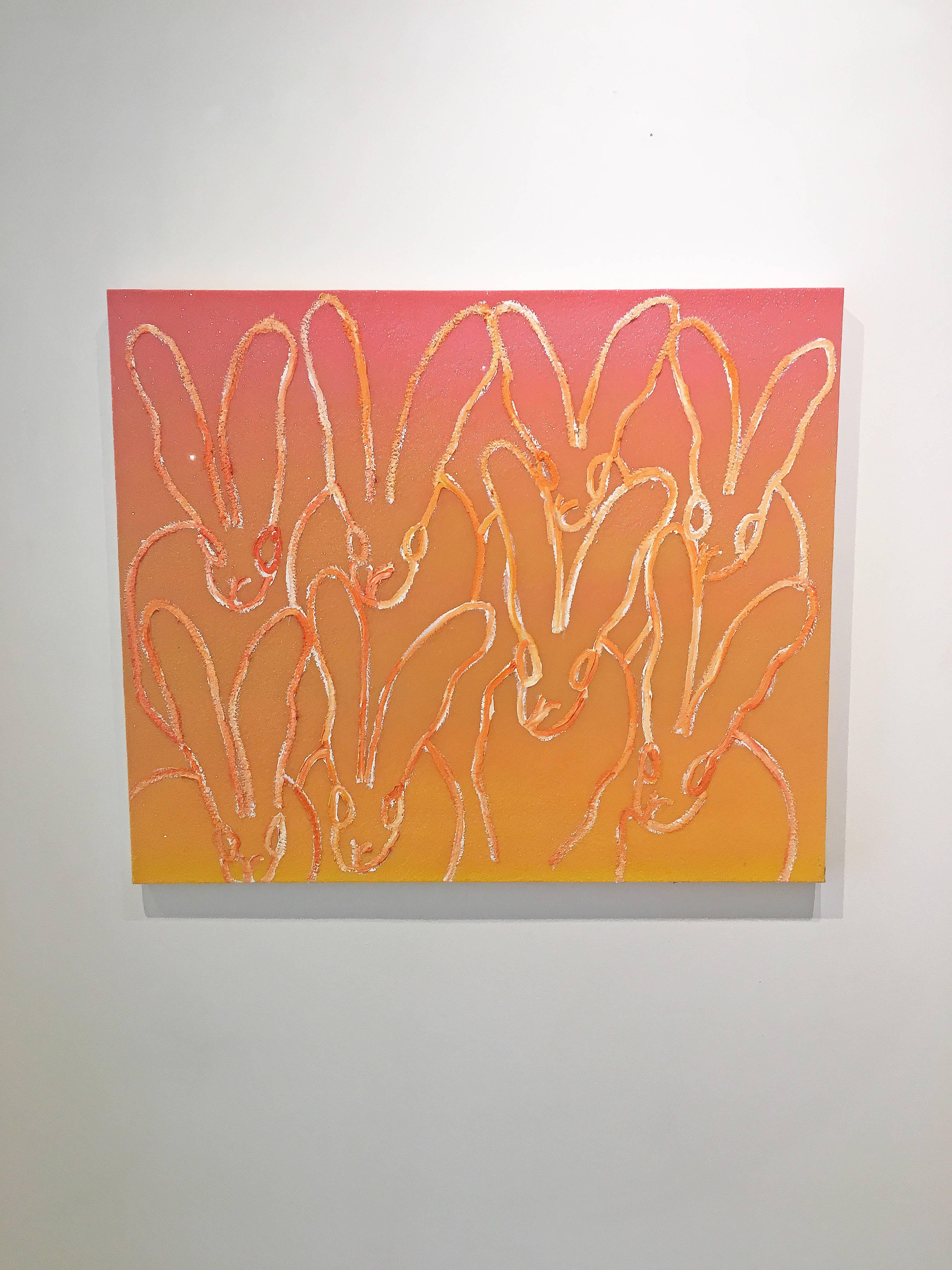 'Istanbul' 2018 by renowned New York City artist, Hunt Slonem. Oil, acrylic, and diamond dust on canvas, 30 x 36 in. This painting features a charming portrait of a 'family' of 8 bunnies outlined in white and orange. The background is painted in a