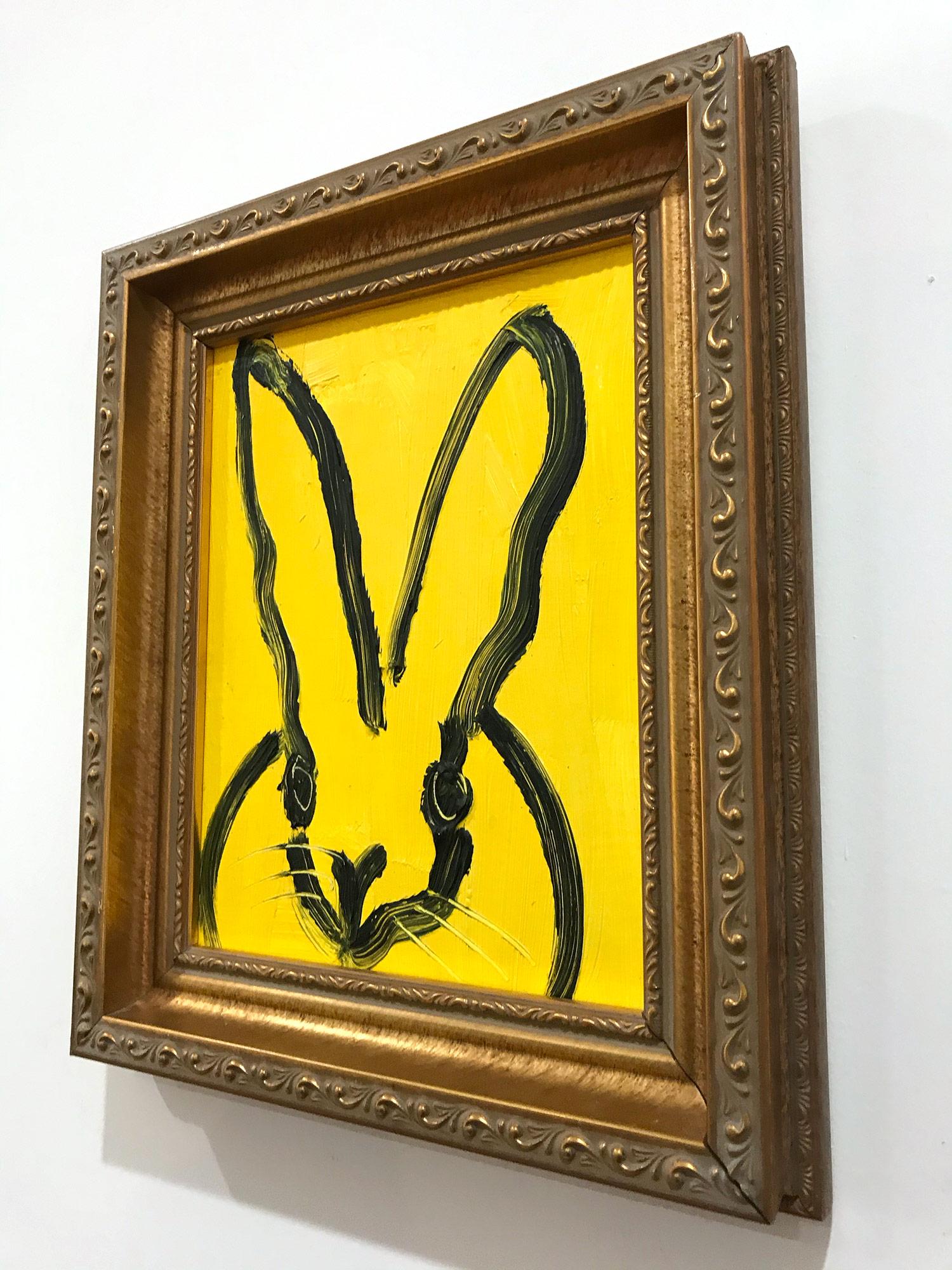 A wonderful composition of one of Slonem's most iconic subjects, Bunnies. This piece depicts a gestural figure of a black bunny on a royal yellow background with thick use of paint. It is housed in a wonderful antique style frame. Inspired by nature