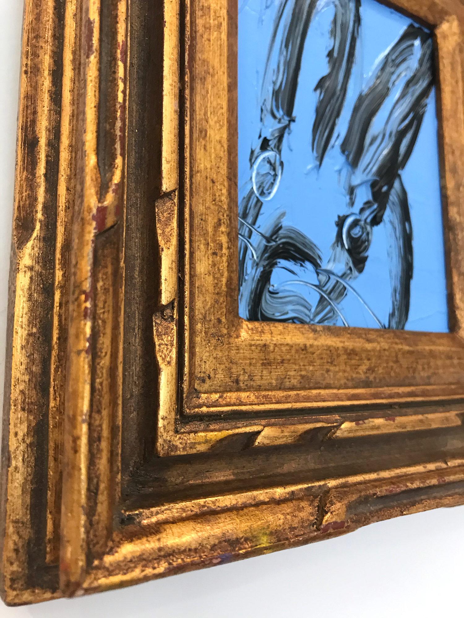 A wonderful composition of one of Slonem's most iconic subjects, Bunnies. This piece depicts a gestural figure of a black bunny on a Peaceful blue background with thick use of paint. It is housed in a wonderful carved wood frame. Inspired by nature