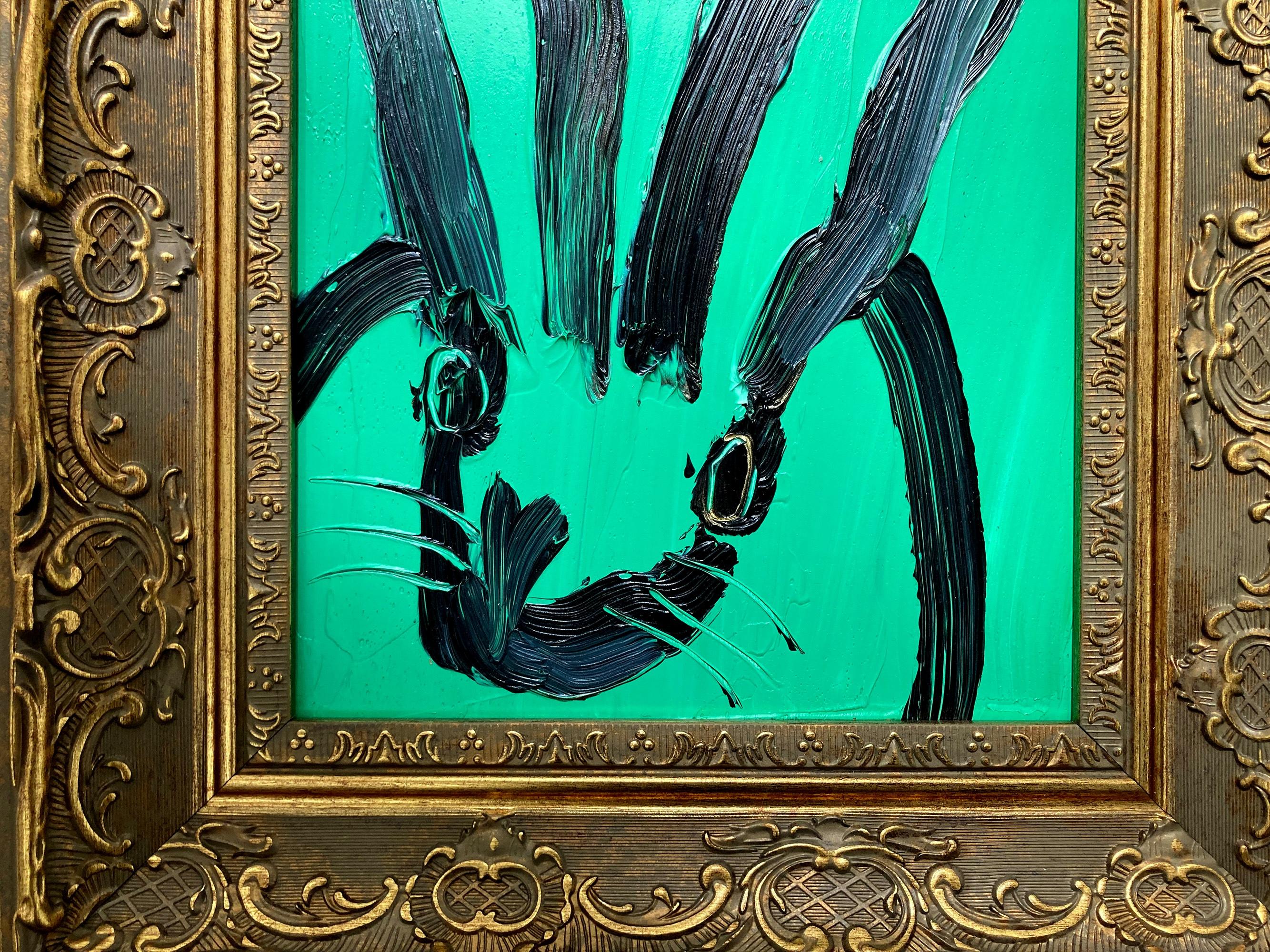 A wonderful composition of one of Slonem's most iconic subjects, Bunnies. This piece depicts a gestural figure of a black bunny on an Aqua green background with thick use of paint. It is housed in a wonderful gold tone wood frame. Inspired by nature