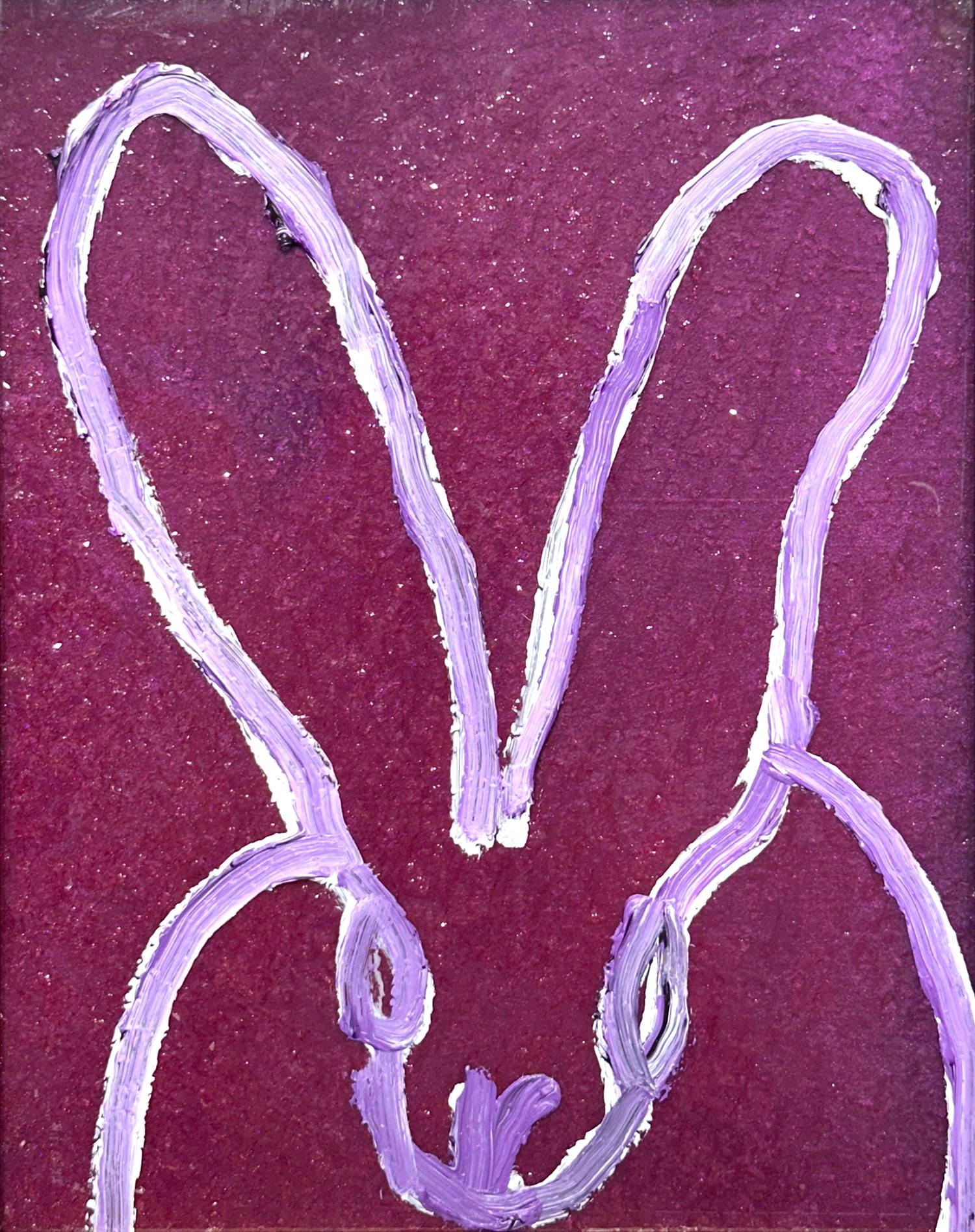 A wonderful composition of one of Slonem's most iconic subjects, Bunnies. This piece depicts a gestural figure of a black bunny on a Purple Magenta background with thick use of paint and diamond dust. It is housed in a wonderful antique frame.