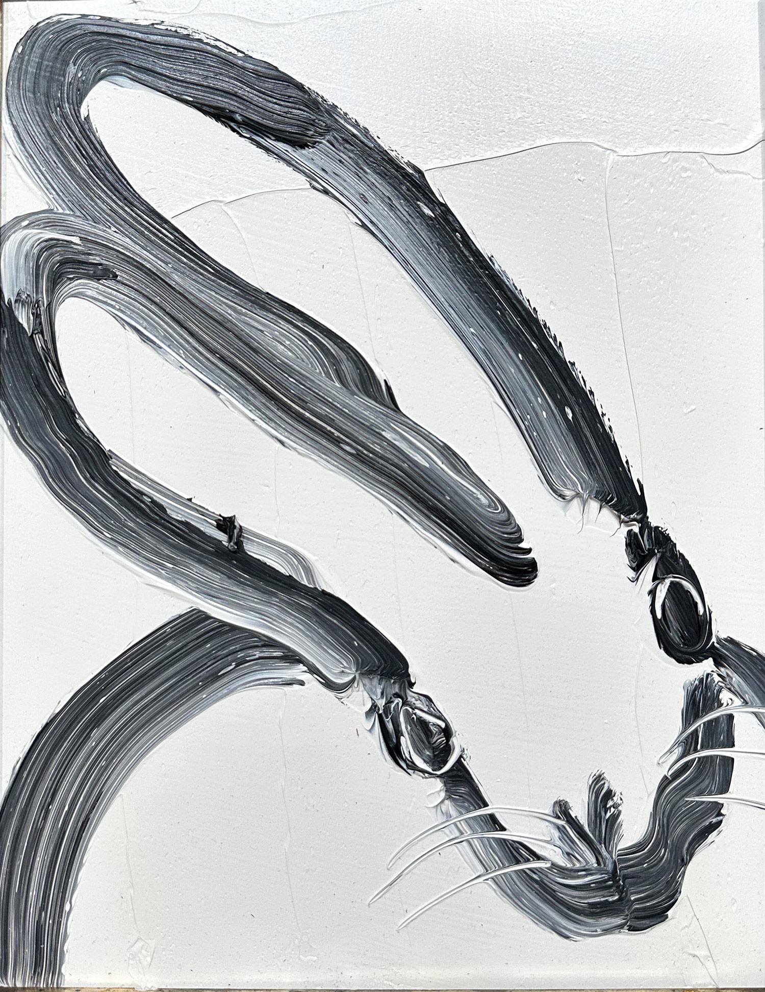 A wonderful composition of one of Slonem's most iconic subjects, Bunnies. This piece depicts a gestural figure of a black bunny on white background with thick use of paint. It is housed in a wonderful gold tone antique style frame. Inspired by