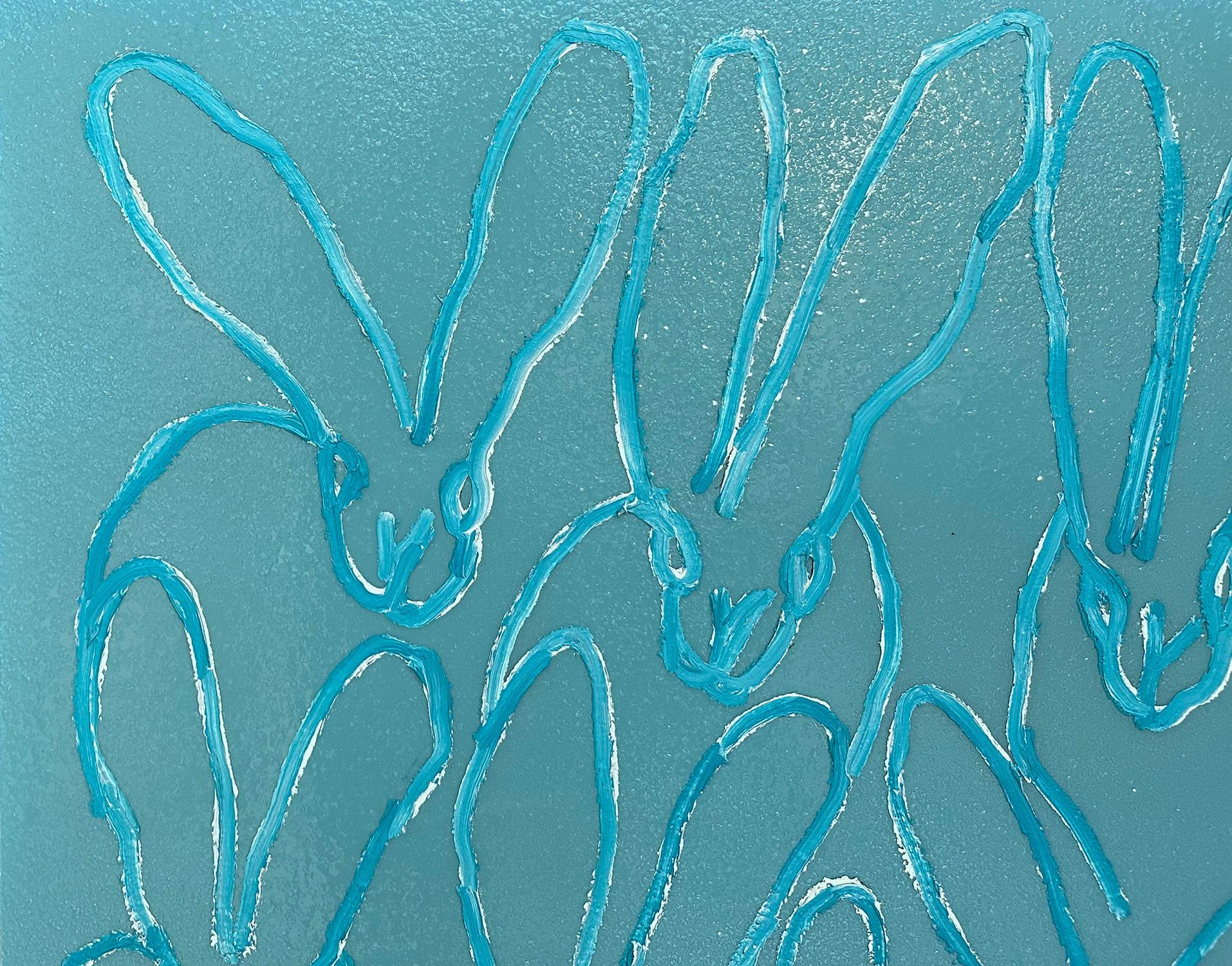 A wonderful composition of one of Slonem's most iconic subjects, Bunnies. This piece depicts gestural figures of white bunnies on a Turquoise blue-green background with thick use of paint and diamond dust. Inspired by nature and a genuine love for