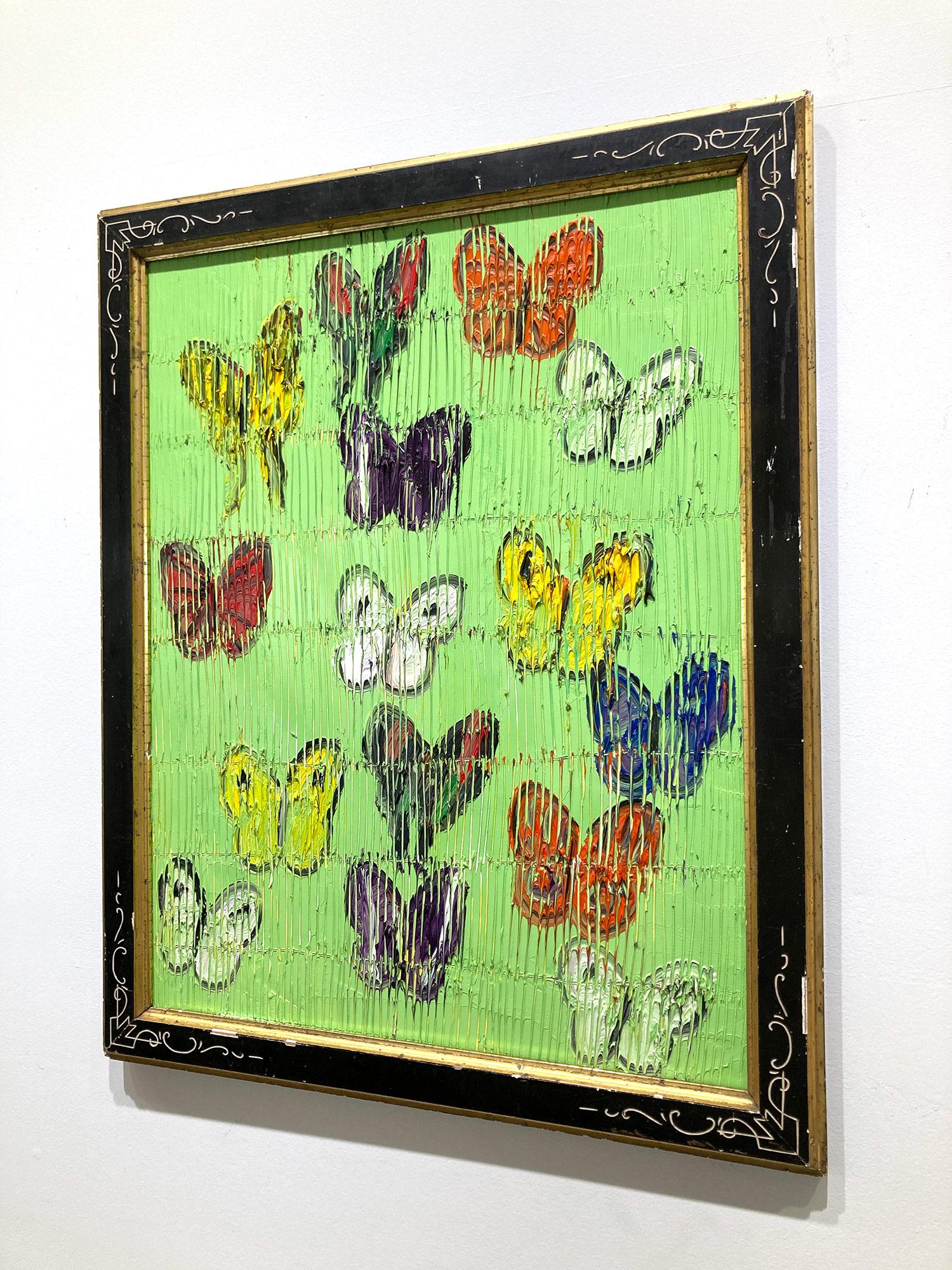 A wonderful composition of one of Slonem's most iconic subjects, Butterflies. This piece depicts multicolor delicate butterflies in ascension placed in a wonderful Paris Green landscape. Slonem traces his famous crosshatch details throughout the
