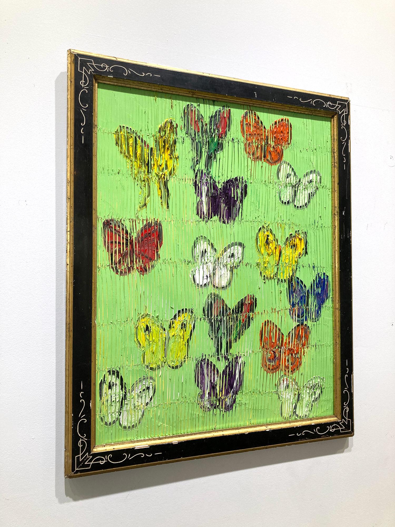 A wonderful composition of one of Slonem's most iconic subjects, Butterflies. This piece depicts multicolor delicate butterflies in ascension placed in a wonderful Paris Green landscape. Slonem traces his famous crosshatch details throughout the