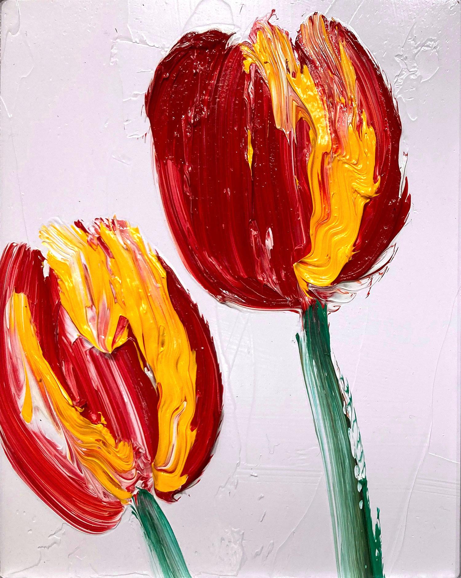 A wonderful composition of one of Slonem's newest series, Tulips. This piece depicts gestural figures of red and yellow Tulips on a light lavender background with thick use of paint. It is housed in a wonderful silver style frame. Inspired by nature