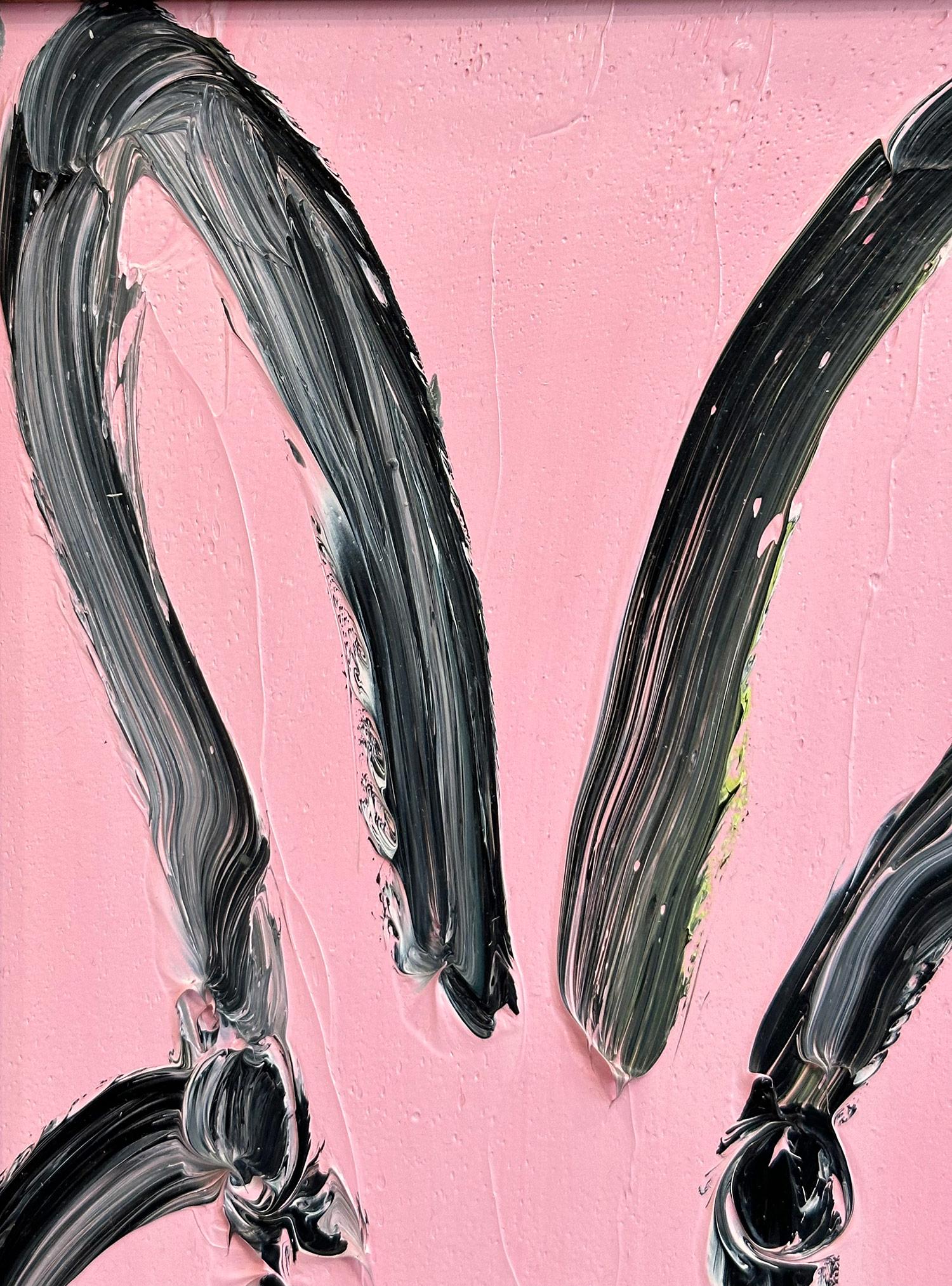 A wonderful composition of one of Slonem's most iconic subjects, Bunnies. This piece depicts a gestural figure of a black bunny on a Cherry Blossom pink background with thick use of paint. It is housed in a wonderful antique style gold frame.