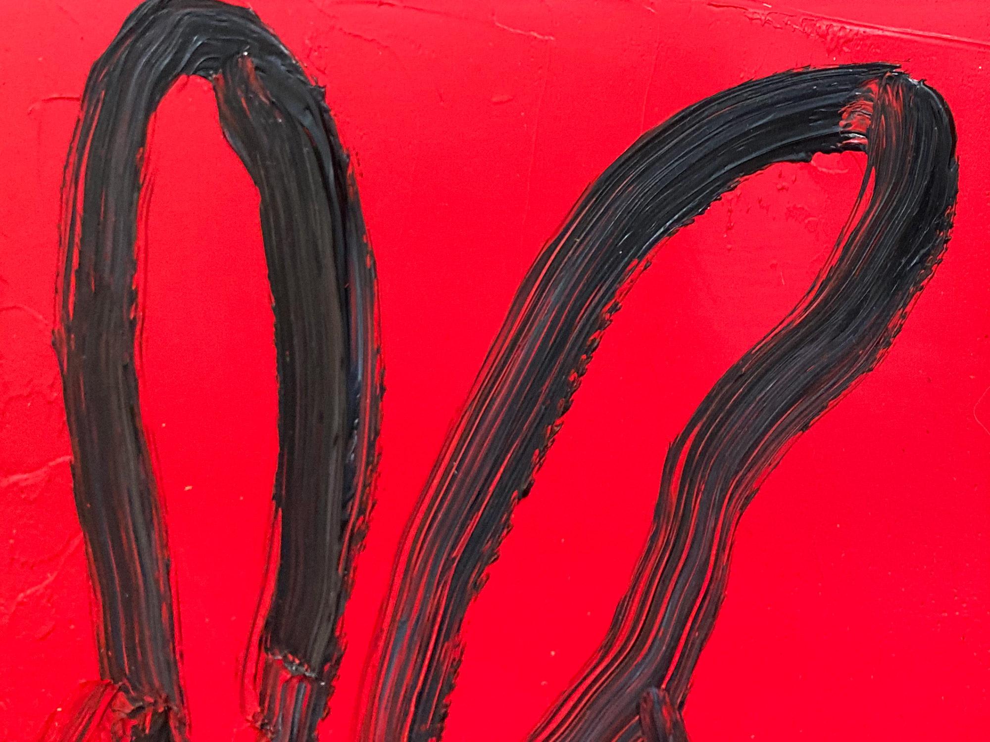 A wonderful composition of one of Slonem's most iconic subjects, Bunnies. This piece depicts a gestural figure of a black bunny on a Lipstick Red background with thick use of paint. It is housed in a wonderful robust antique frame. Inspired by