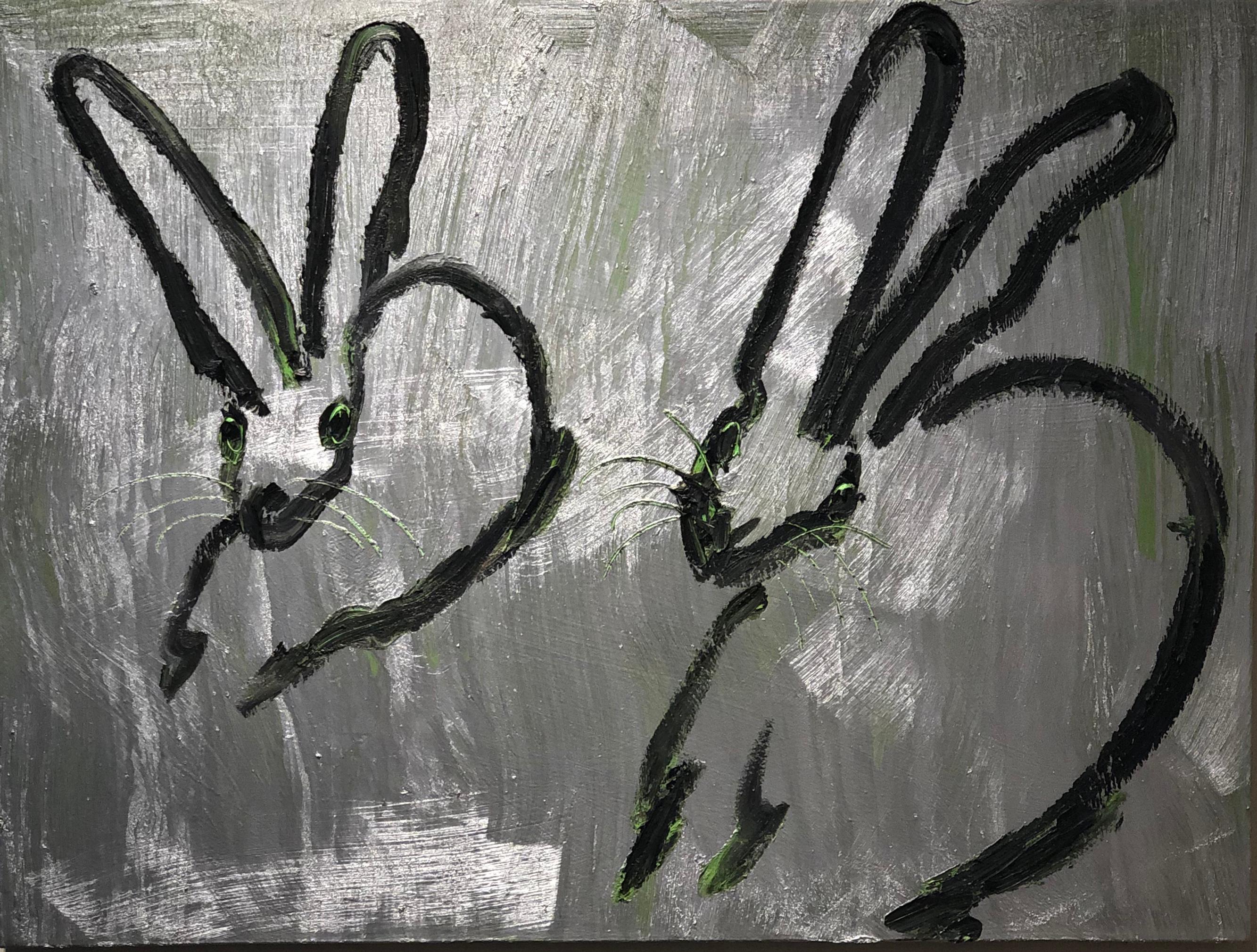 This Hunt Slonem duo of two silver bunnies with green under painting. Unframed. 
New York painter, Hunt Slonem is best known for his Neo –Expressionist paintings of bunnies, tropical birds and other exotic flora and fauna. Slonem’s recognizable