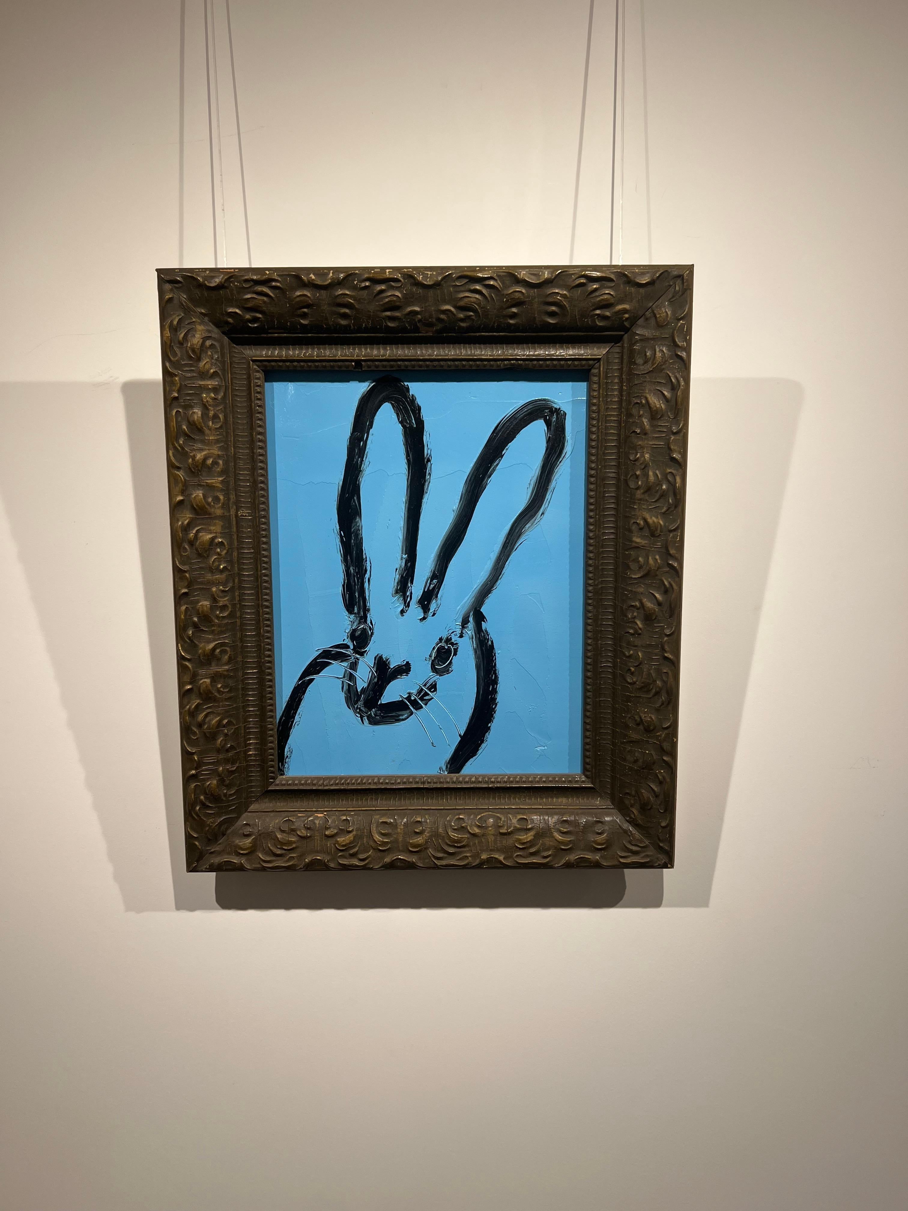 Original and unique artwork by Hunt Slonem.
Oil on wood, blue bunny.

Painting is framed, as seen in the images. Dimensions of the artwork with the frame: 19.5 x 16.5 inches 
Signed Verso
Please note that Hunt Slonem paintings with frames may show