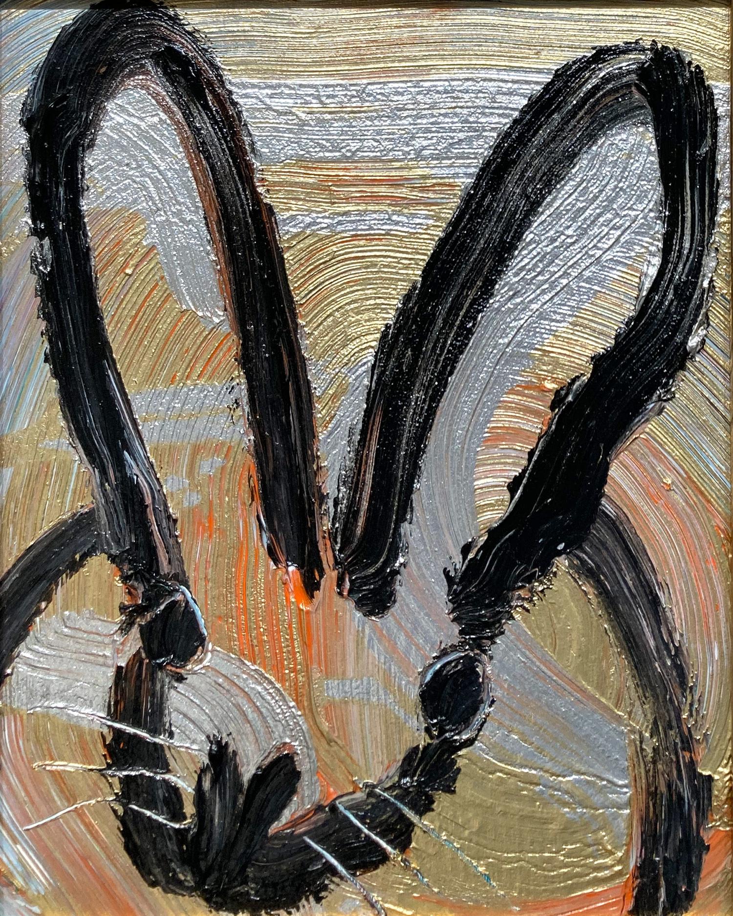 A wonderful composition of one of Slonem's most iconic subjects, Bunnies. This piece depicts a gestural figure of a black bunny on a silver and gold with orange background with thick use of paint. Inspired by nature and a genuine love for animals,