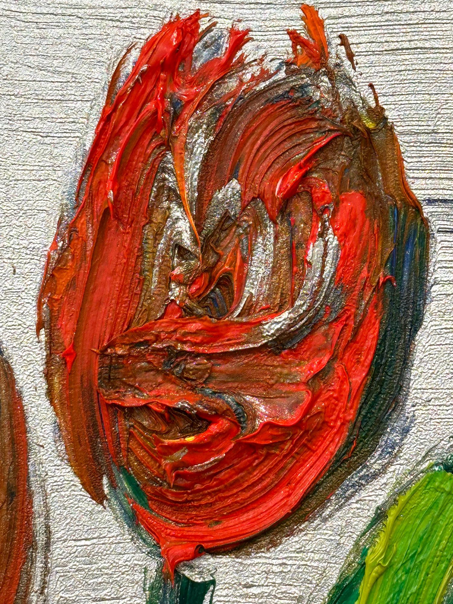A wonderful composition of one of Slonem's newest series, Tulips. This piece depicts 2 gestural red Tulips on a silver background with thick use of paint. It is housed in a wonderful gold antique style frame. Inspired by nature and a genuine love