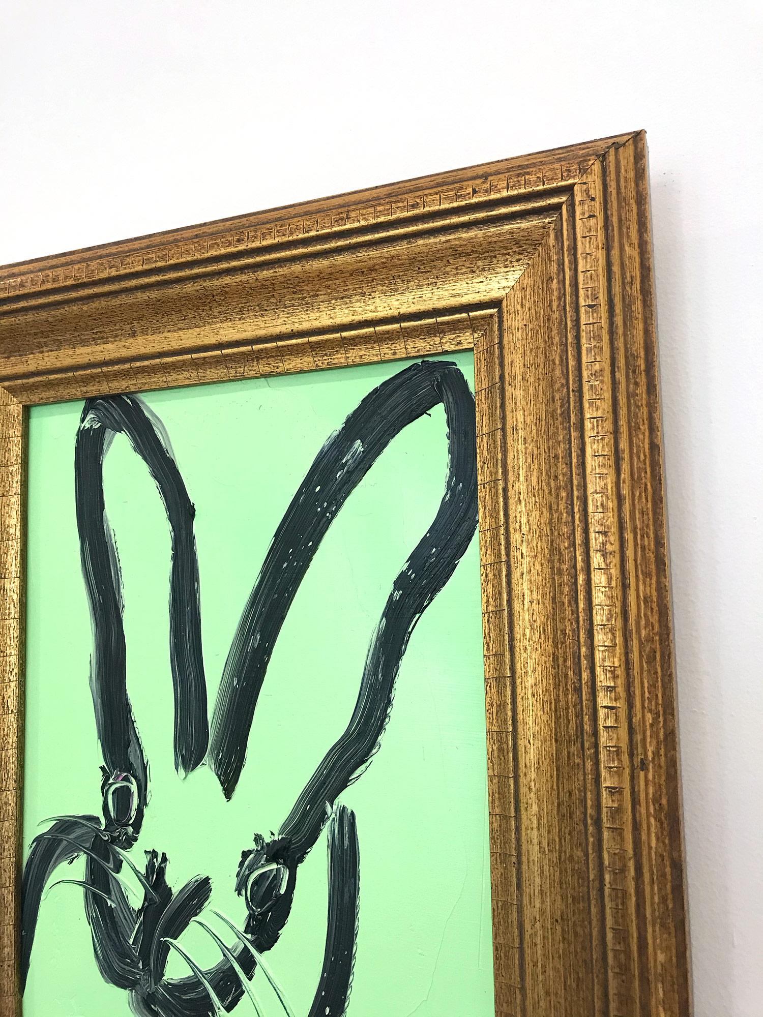 A wonderful composition of one of Slonem's most iconic subjects, Bunnies. This piece depicts a gestural figure of a black bunny on a green background with thick use of paint. Inspired by nature and a genuine love for animals, Slonem's paintings