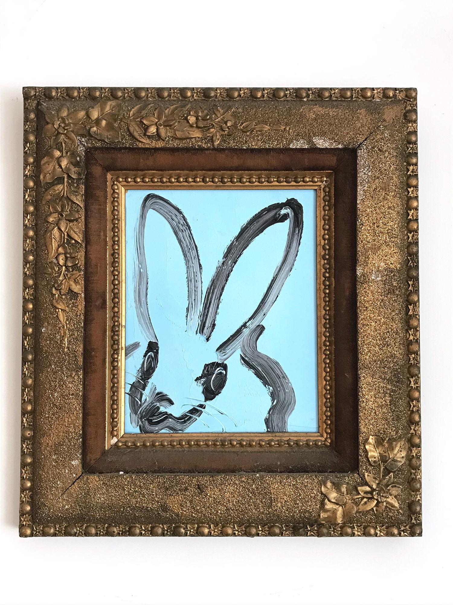 A wonderful composition of one of Slonem's most iconic subjects, Bunnies. This piece depicts a gestural figure of a black bunny on a blue background with thick use of paint. It is housed in a wonderful antique 19th Century frame. Inspired by nature